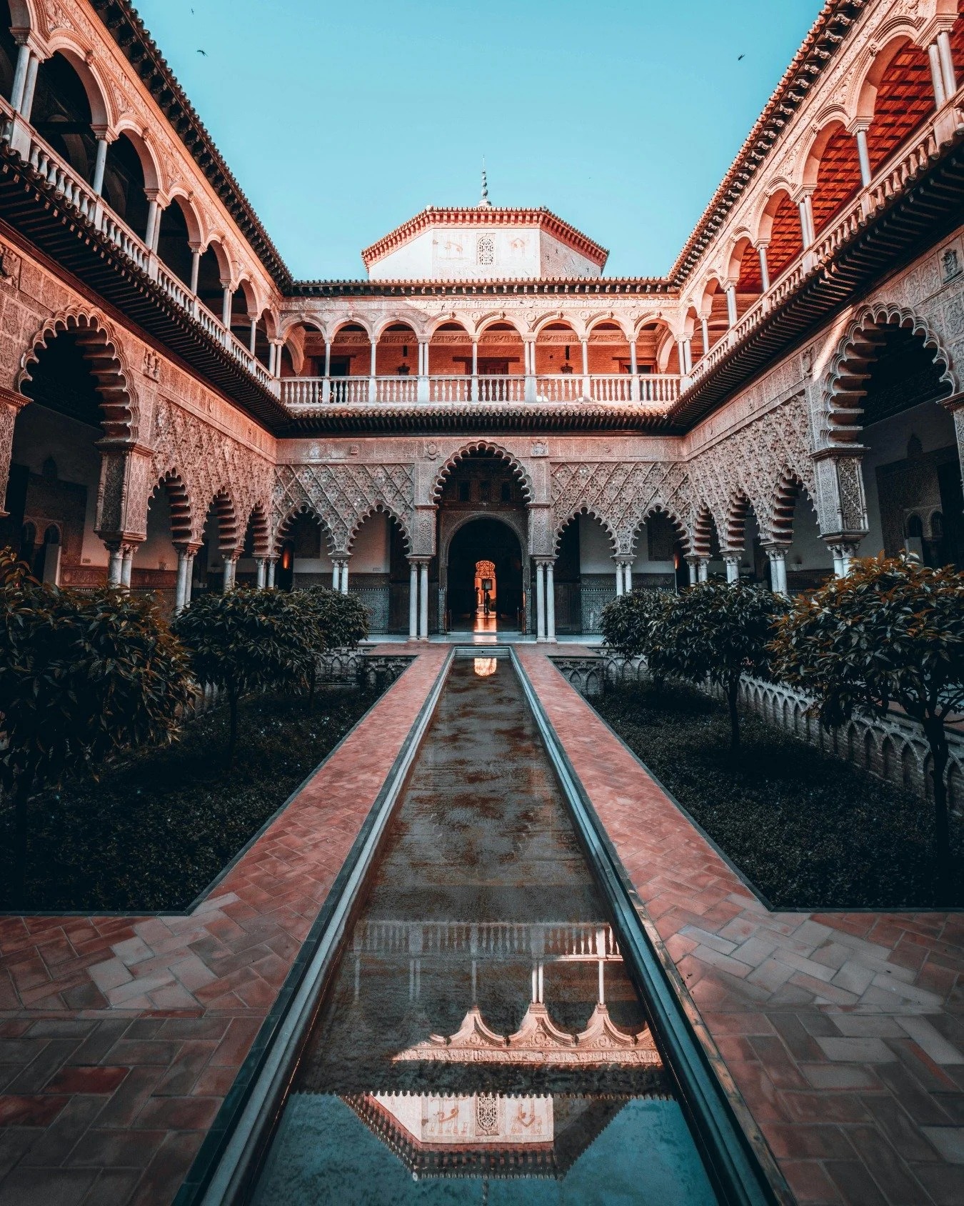 A composition built on earth and light.

The Real Alc&aacute;zar of Seville carries a kind of grandeur that absorbs you. 

Spanish sunlight settles into a spectrum of creams, sands, and sun-warmed stone, creating a luminous base that catches and hold