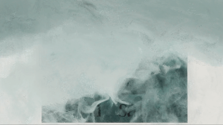 Close-up of a turbulent ocean wave crashing.