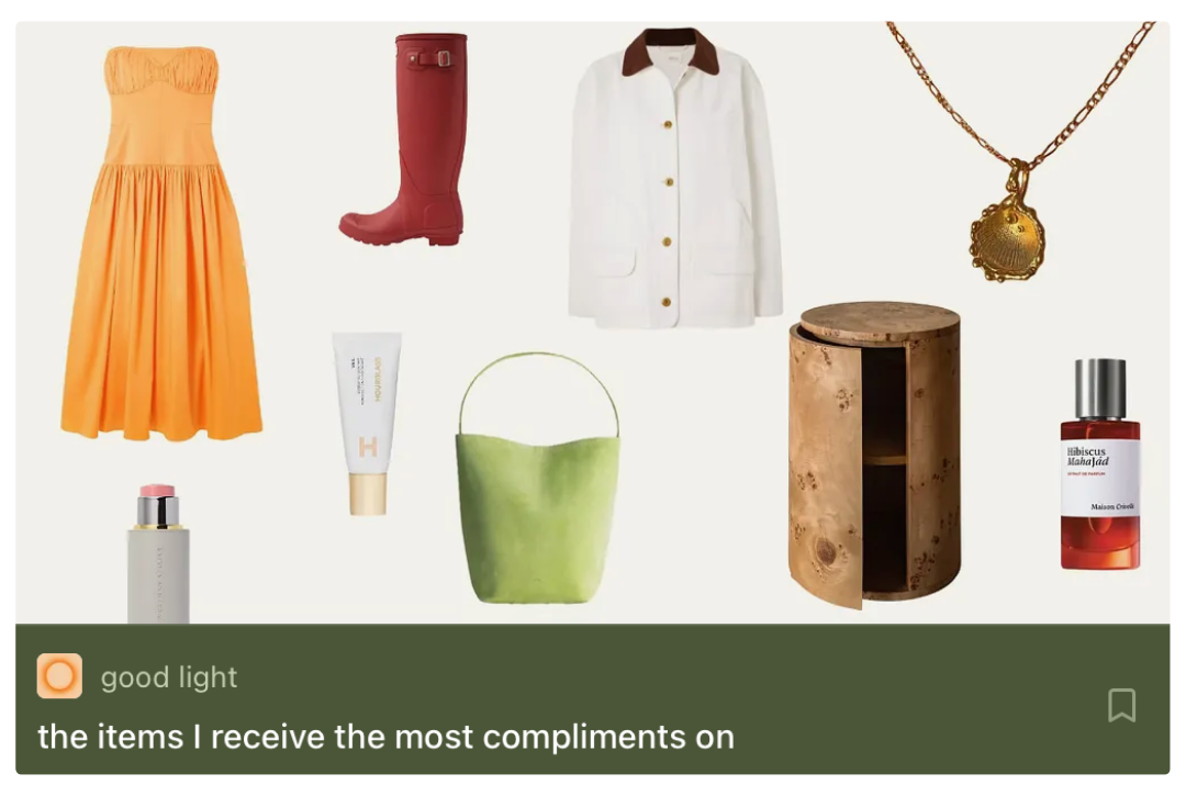 Collection of fashion and beauty items including an orange dress, red rain boots, white jacket with brown collar, gold necklace, small green handbag, wooden side table, perfume bottles, and skincare products.