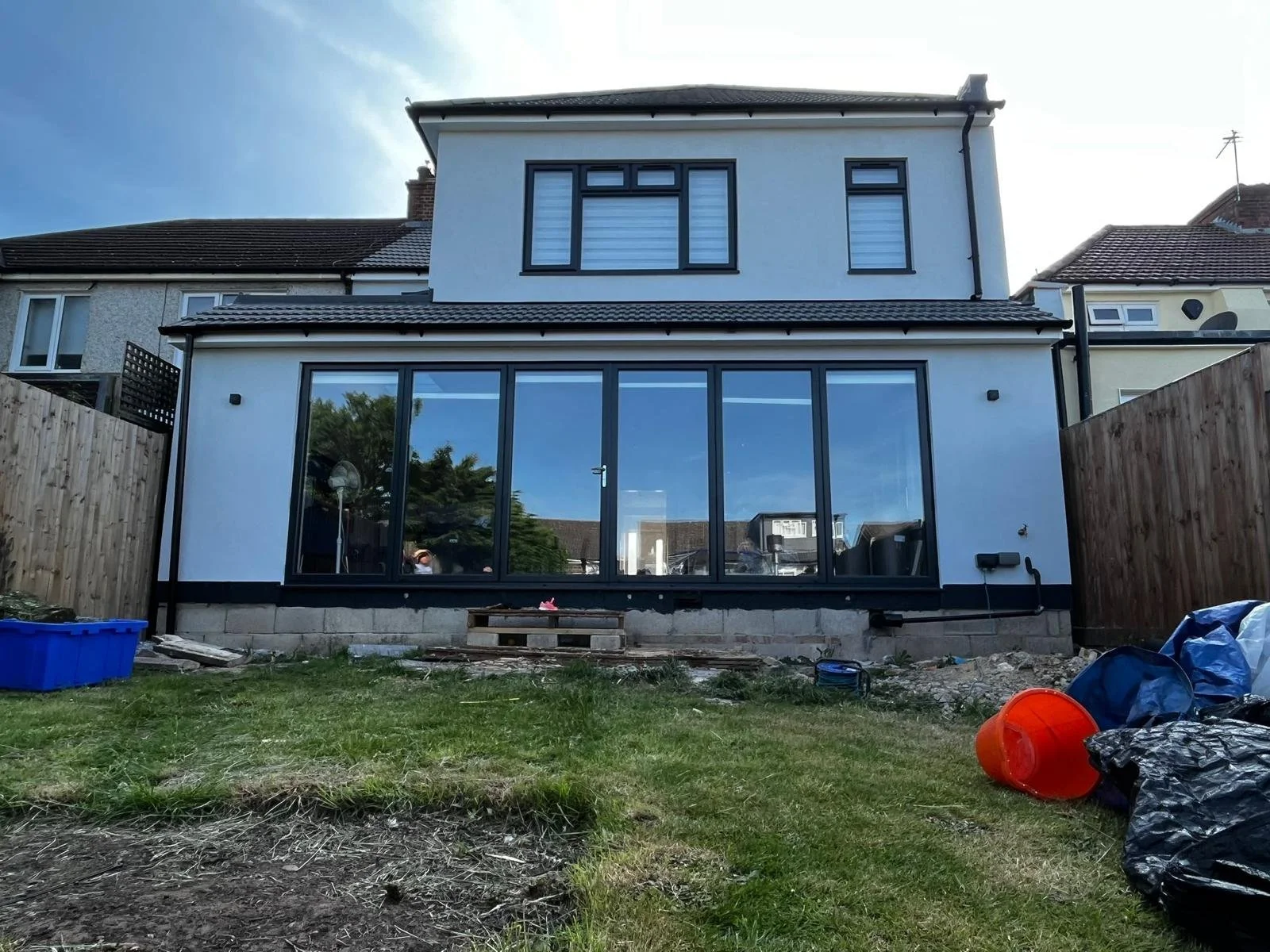 modern silicone render with bi-fold doors.jpeg
