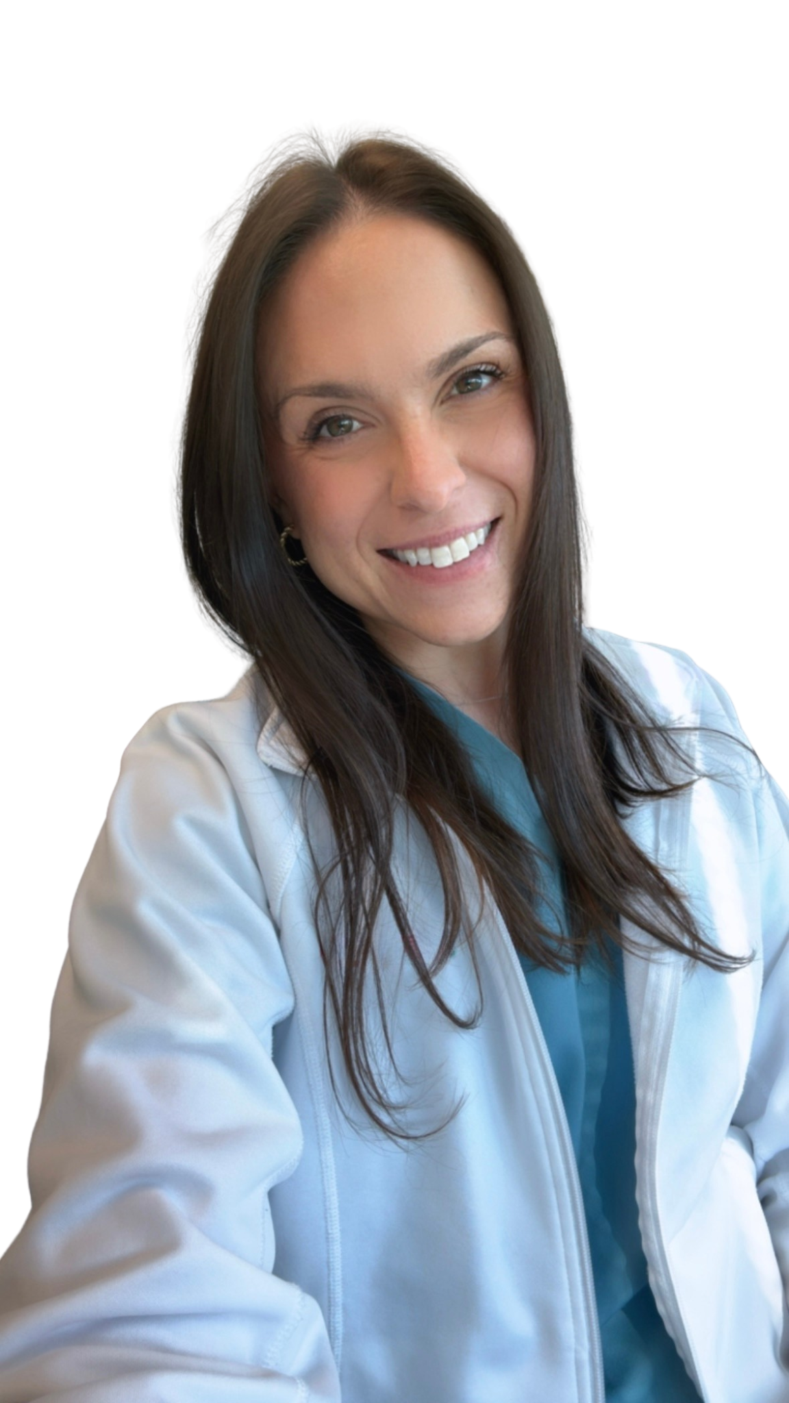 A woman smiling with brown hair, wearing a white medical coat over a teal scrub top, posing against a plain white background.