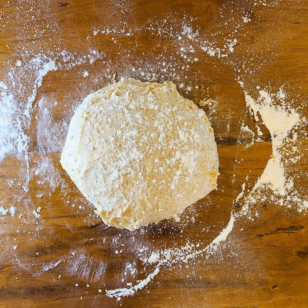 Tweeback bun dough on wooden table.