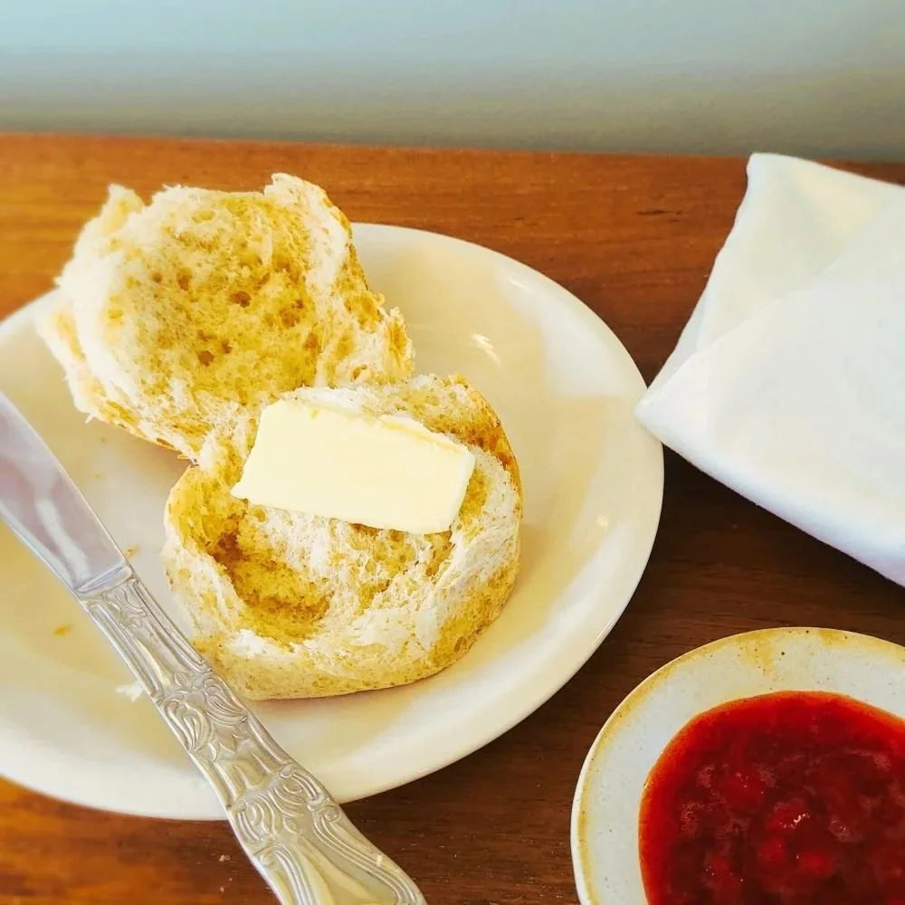 buttered tweeback bun with strawberry jam.