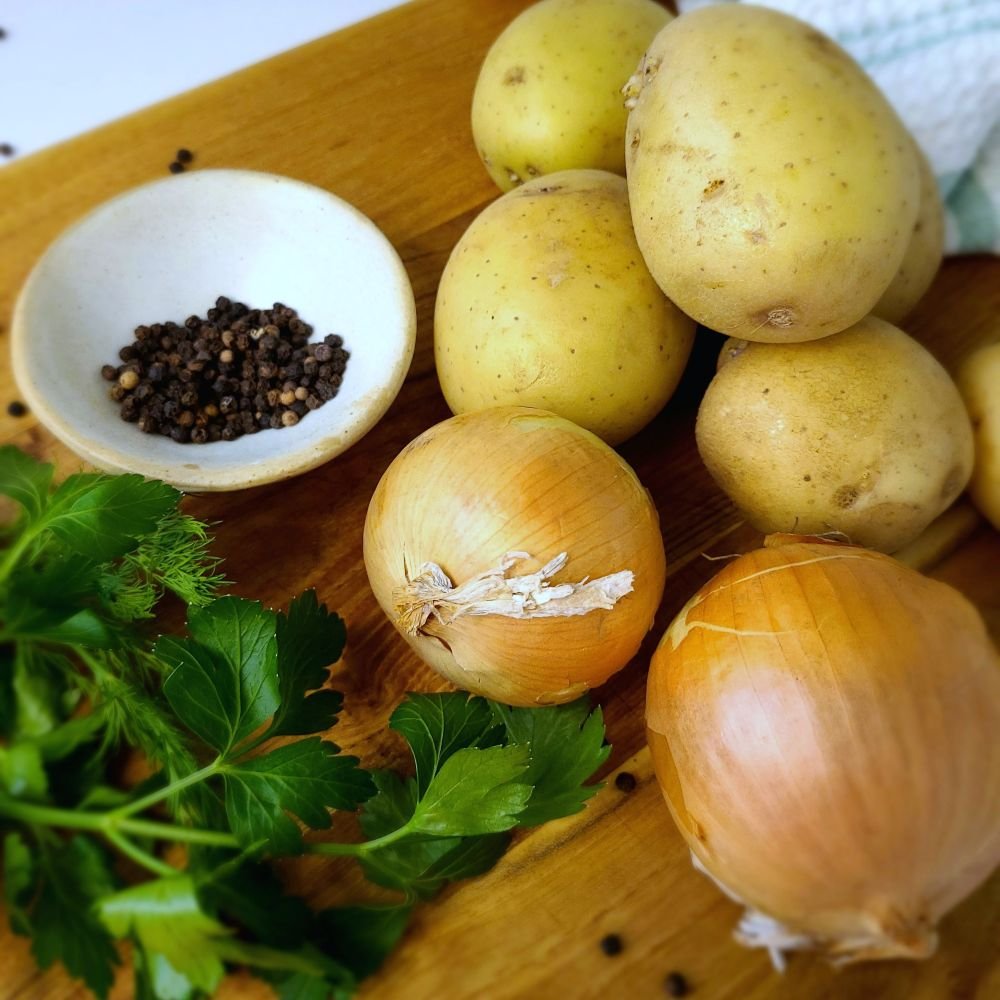 borscht ingredients on a cutting board.
