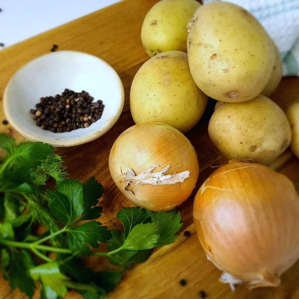 Borscht ingredients on a cutting board.