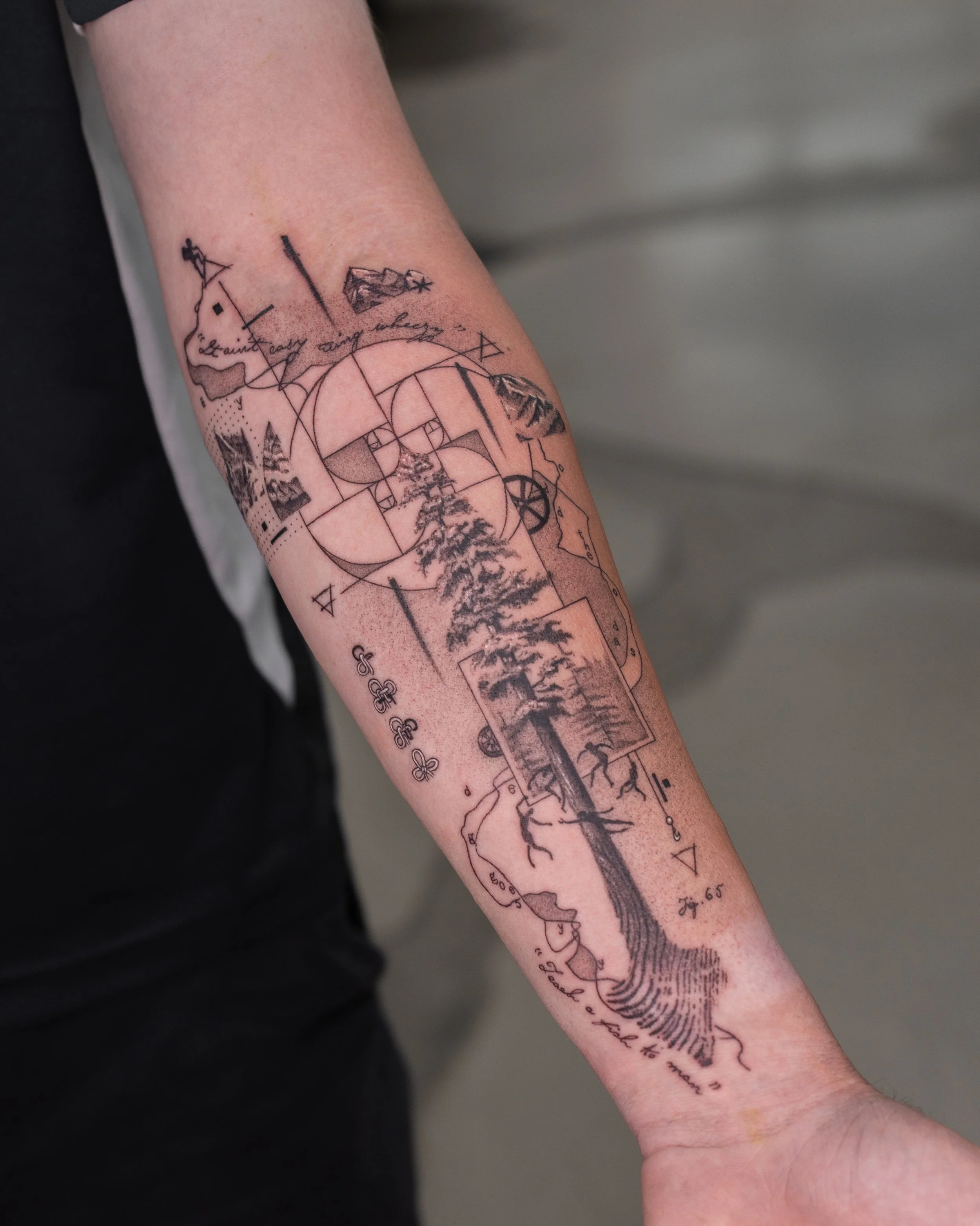 Fine line Tattoo of a detailed landscape scene with trees, mountain, and a stream, intertwined with geometrical shapes.
