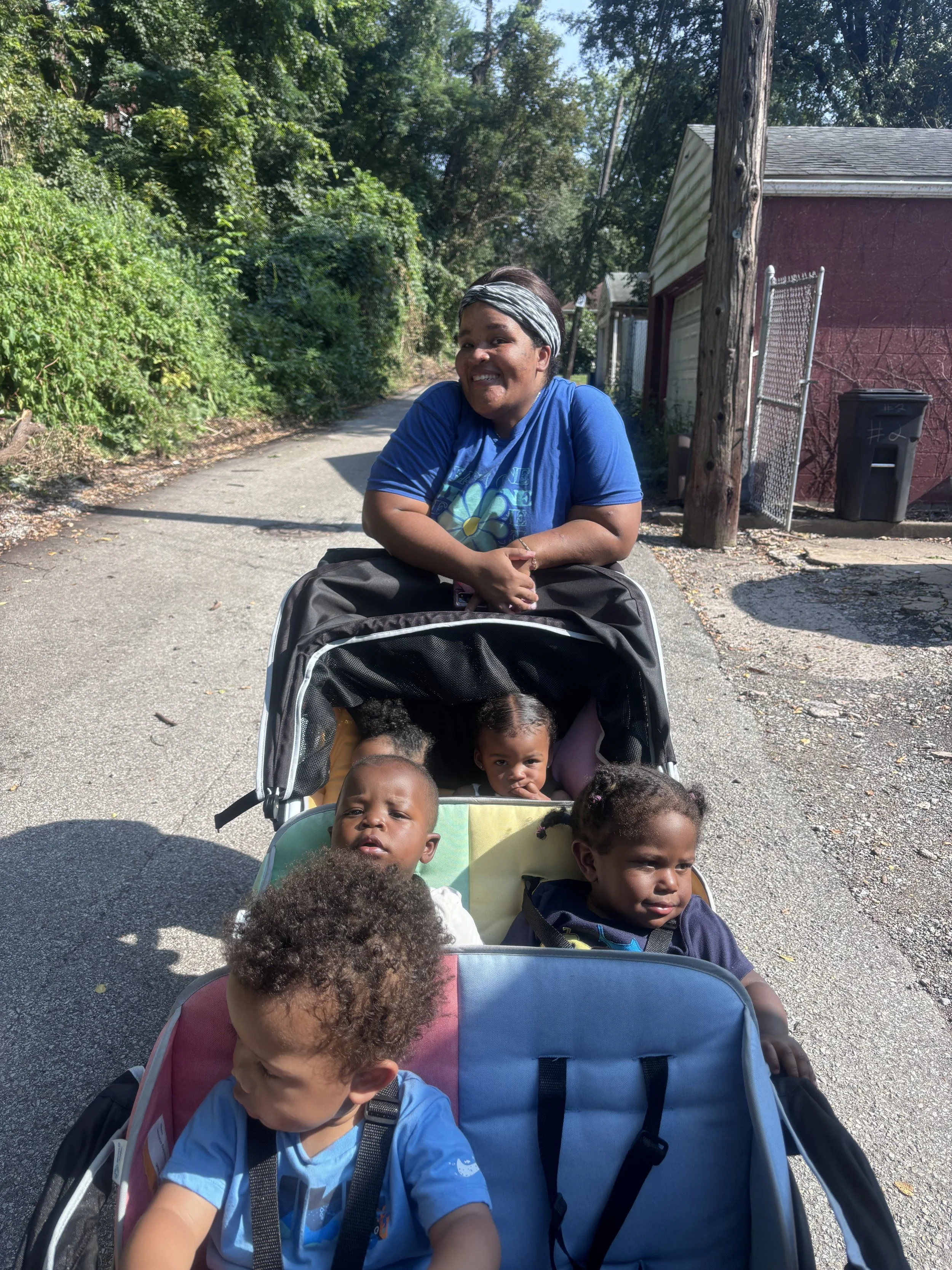 Our Early Head Start teacher takes her class on a daily walk outside to explore the surroundings.