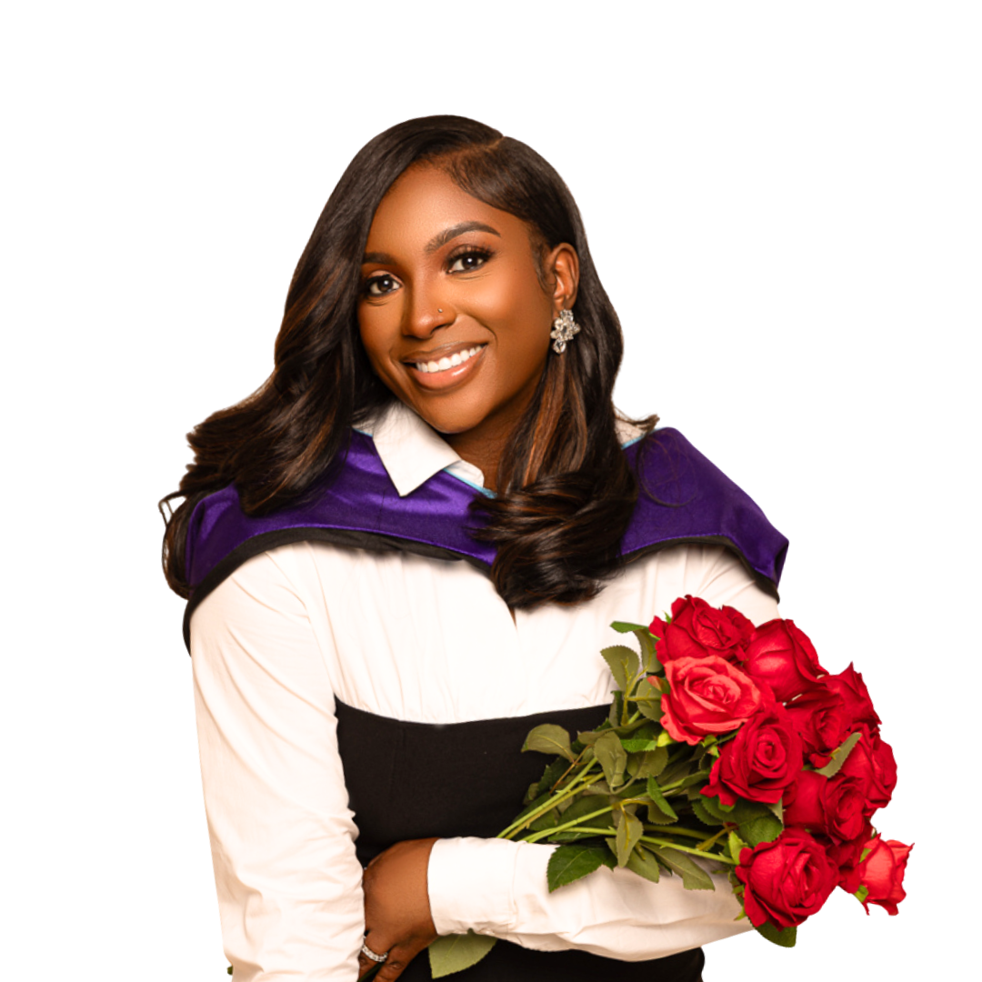 Ms. Tierra Porter in her Masters graduation gown holding a bouquet of red roses