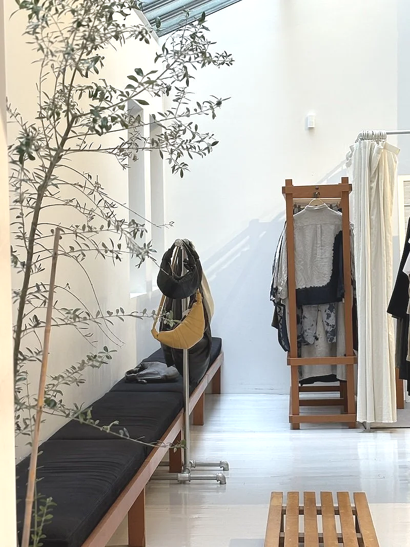 la garconne in tribeca, high end designer clothing store, minimalist aesthetic, beautiful space for shopping