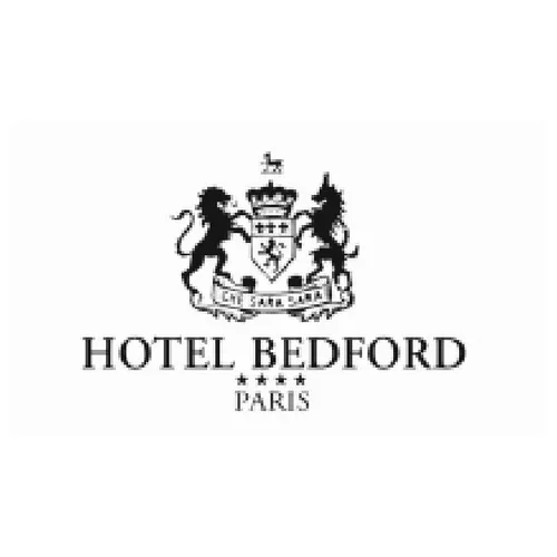 Logo de l'Hôtel Bedford Paris avec un blason et deux lions