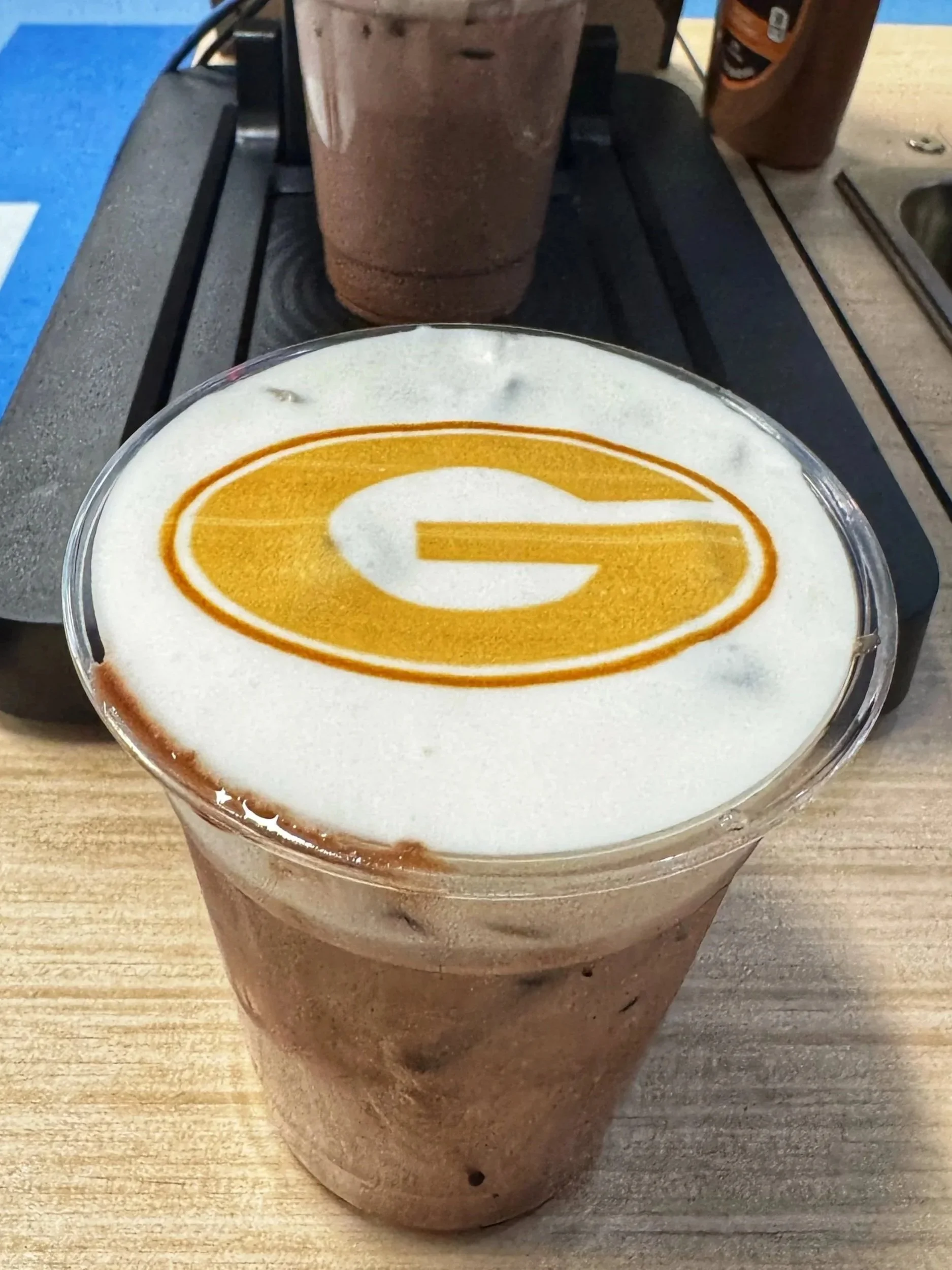 Custom branded latte art created by Old City Coffee Cart using a Ripple machine for corporate coffee catering in Knoxville Tennessee.