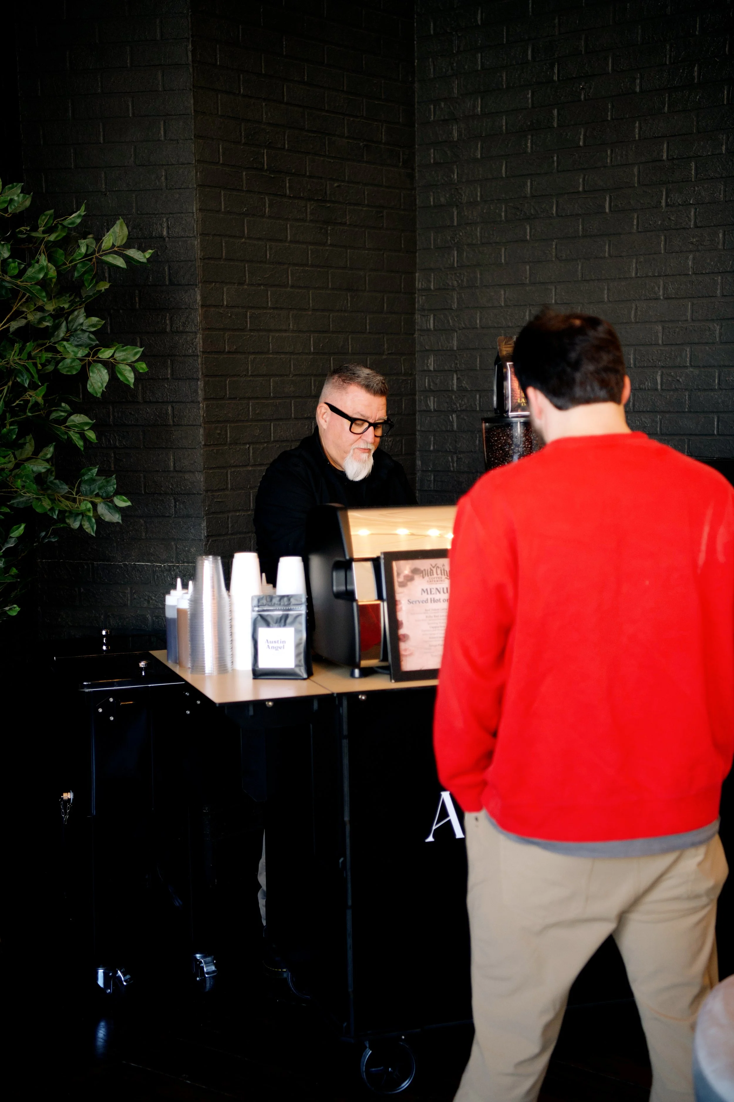 Barista serving espresso drinks from the Old City Coffee mobile coffee cart at a Knoxville Tennessee event