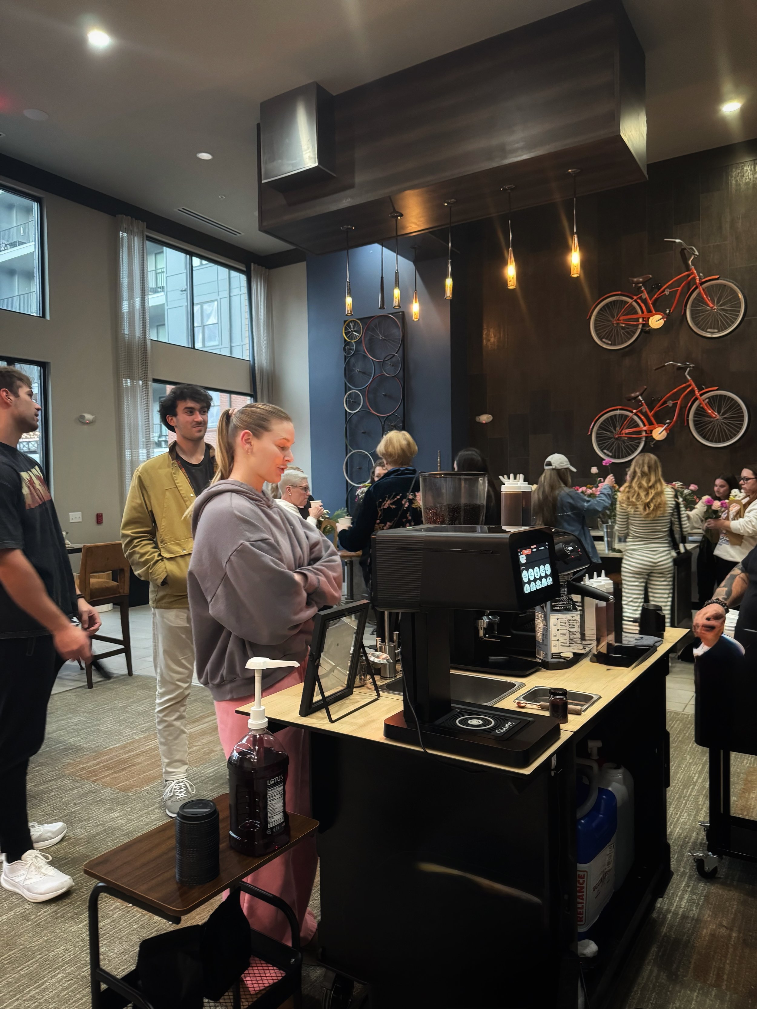 A mobile coffee cart serving coffee to guests during an event in Knoxville, Tennessee.