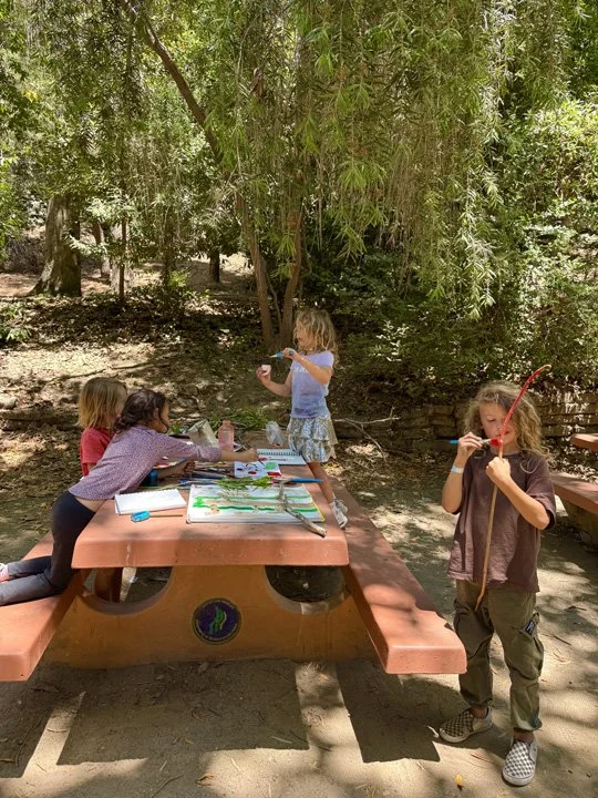 Kids drawing in nature