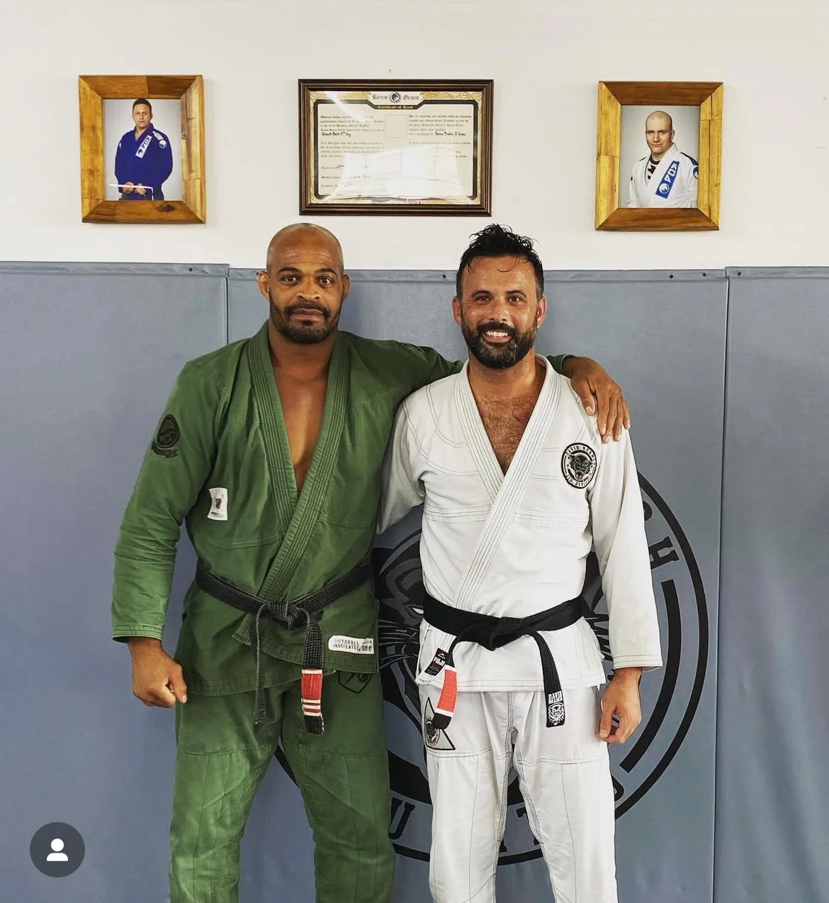 The lead instructors of David Branch Jiu Montville after a fun workout in Montville, NJ. The framed pictures on the wall show legendary Jiu Jitsu coaches Renzo Gracie and John Danaher, as well as David's Black Belt Certificate.