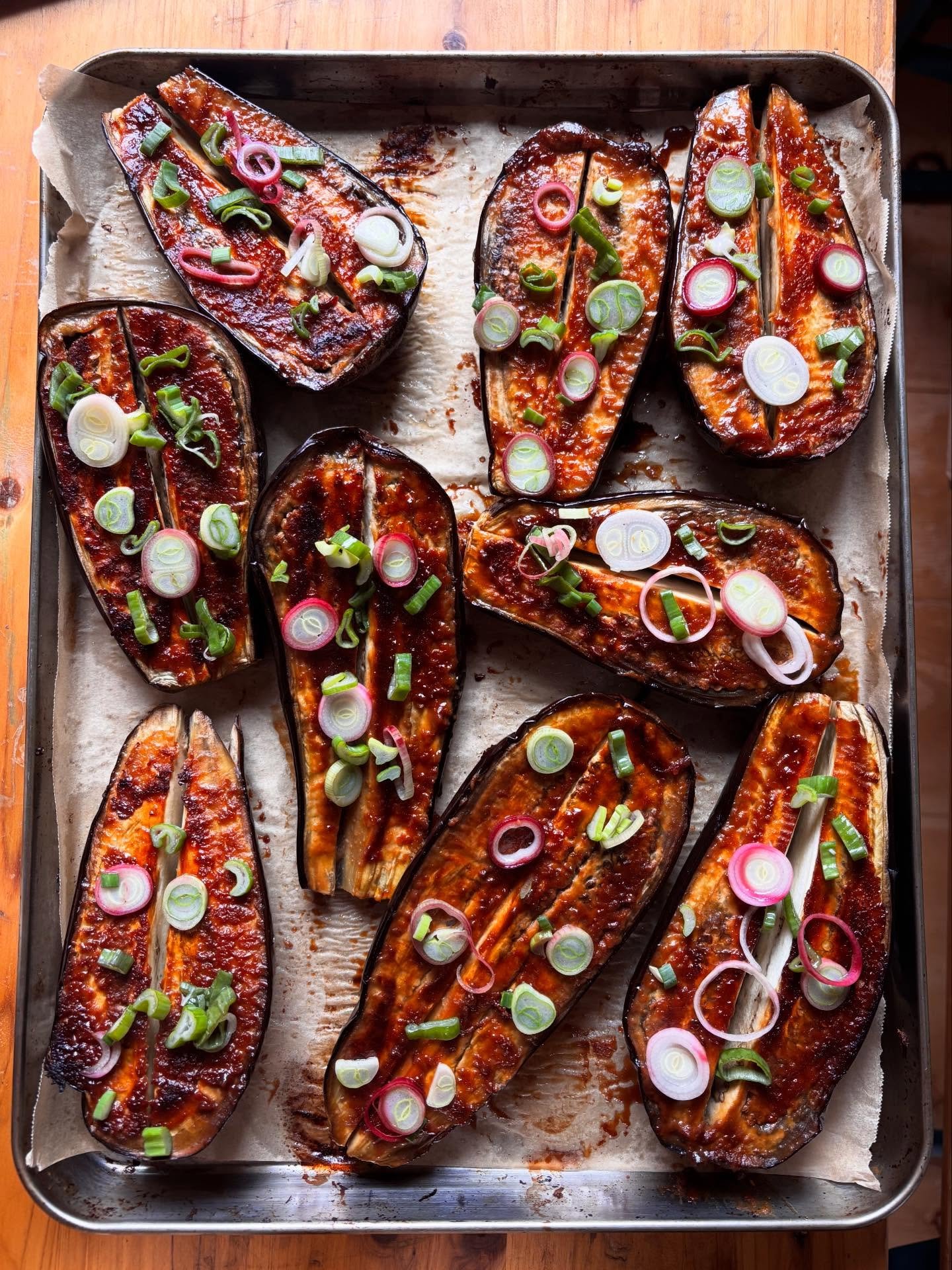 stickiest + butteriest maple miso eggplant

rough recipe (best to guesstimate here and taste as you sauce) ~ preheat oven to 375&deg;F, half your whole eggplants and combine the following: 

2 tbsp. white miso
1 tbsp. tamari
1 tbsp. rice vinegar 
1 t
