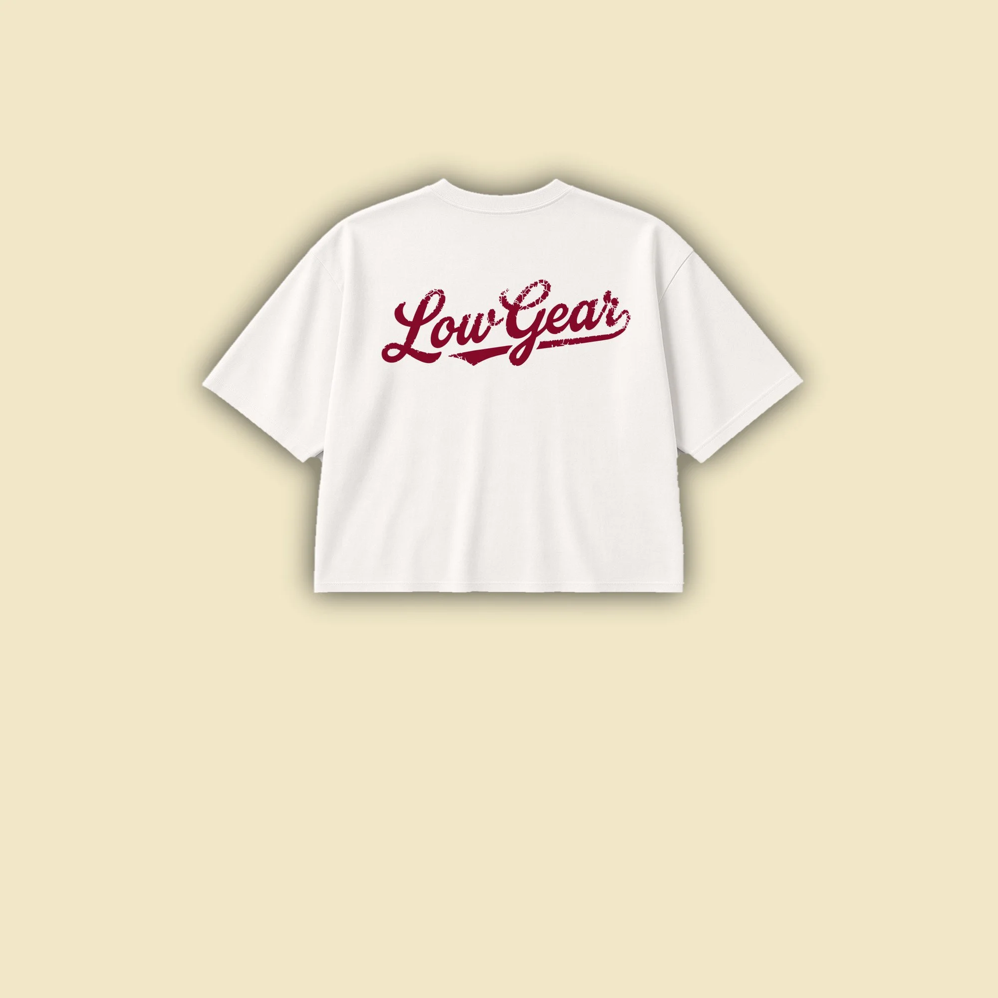 Short Shift Tee in vintage white, back view, with the burgundy Low Gear script across the upper back