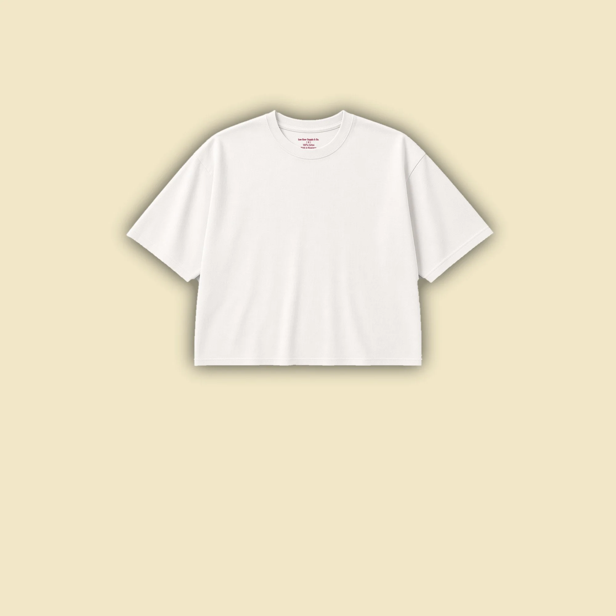 Short Shift Tee in vintage white, front view, plain cropped boxy tee with a burgundy neck print