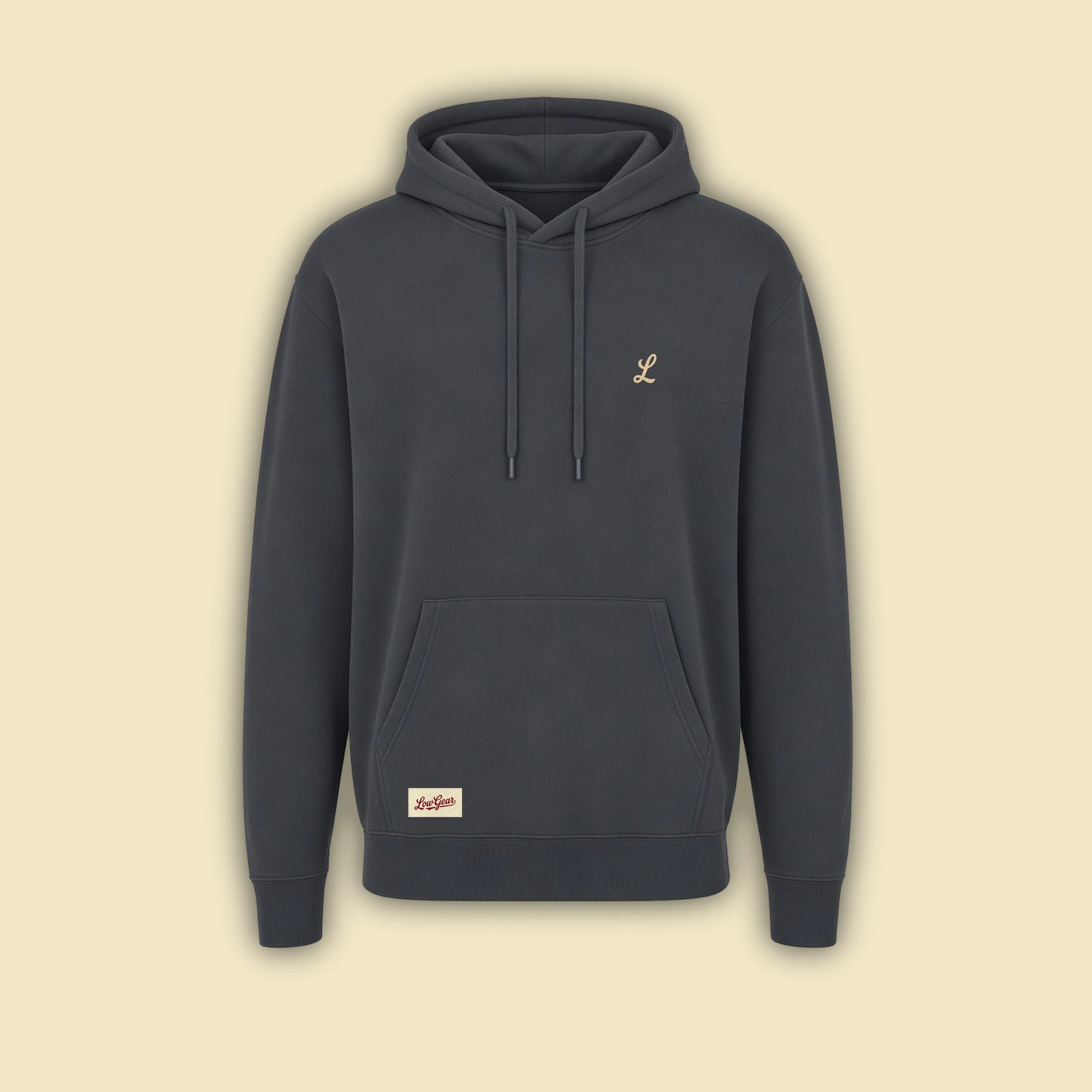 Low Gear Hoodie in faded charcoal Pepper with a small sand flock L on the left chest and a cream woven Low Gear label on the pouch pocket