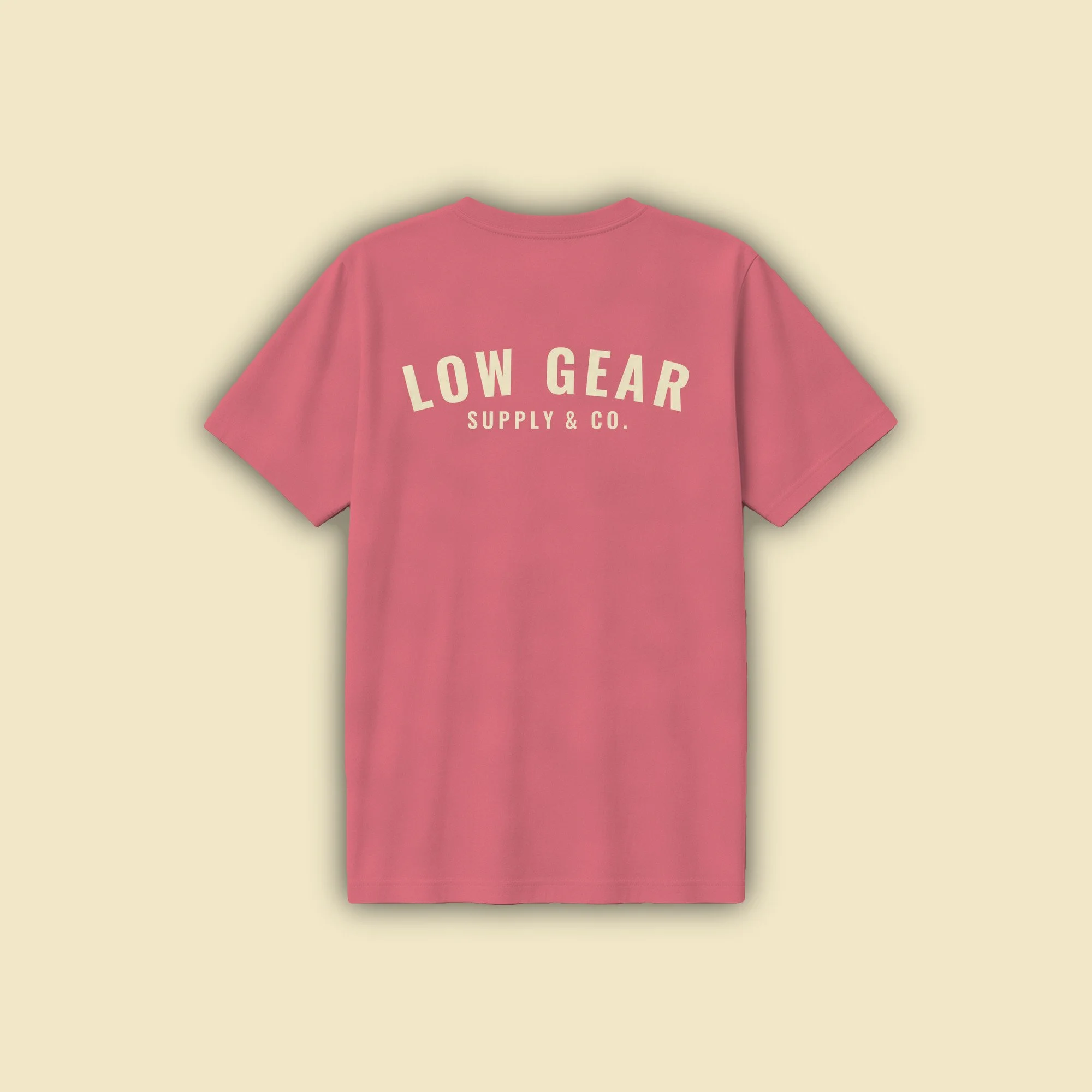 Graft Tee in washed red, back view with LOW GEAR arched across the full back in smooth cream