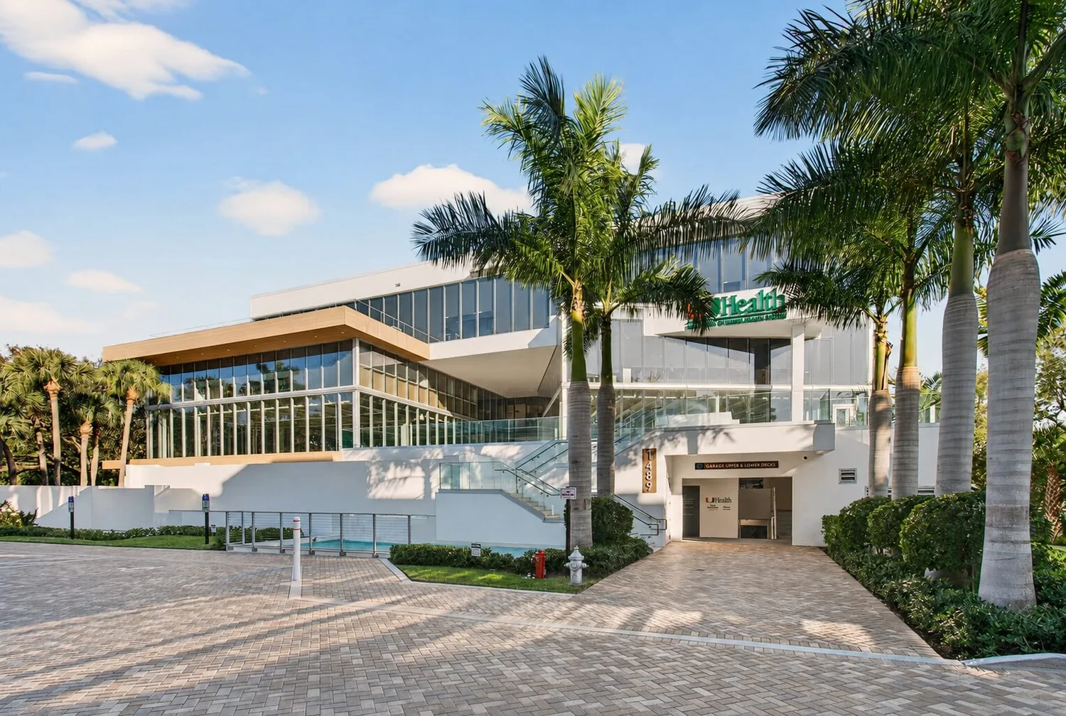 Daytime exterior of Artist MD in Boca Raton inside KHOspace at the UHealth building