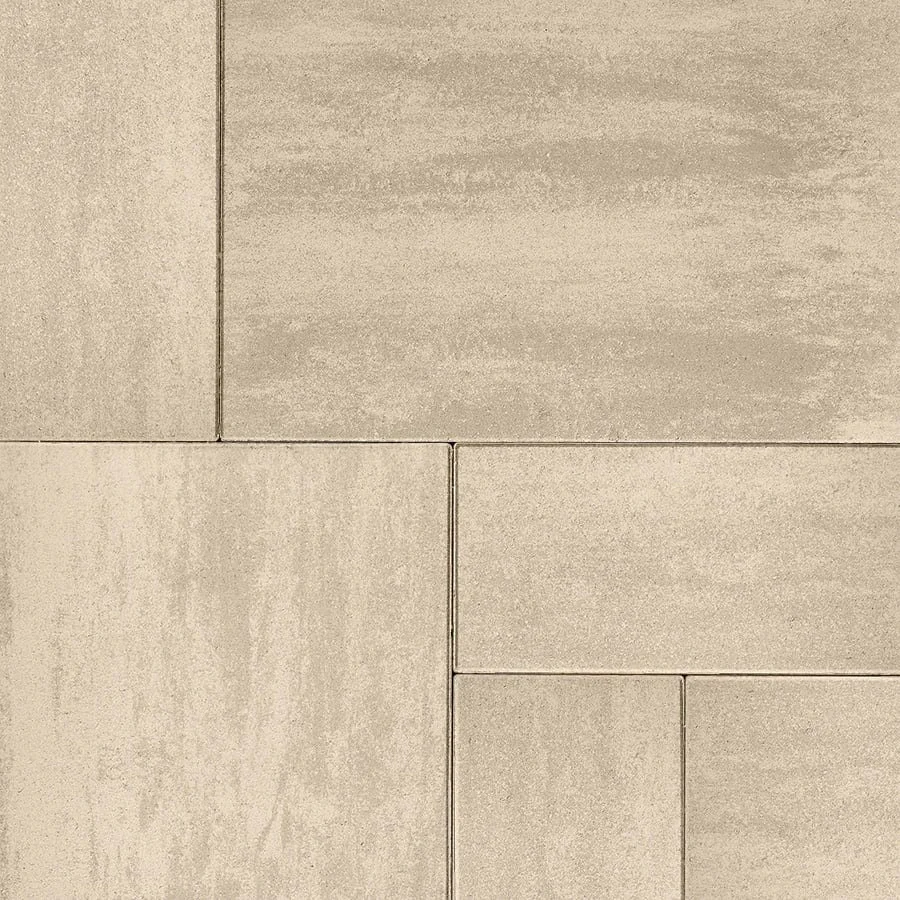 Close-up view of beige stone tiles arranged in a geometric pattern.