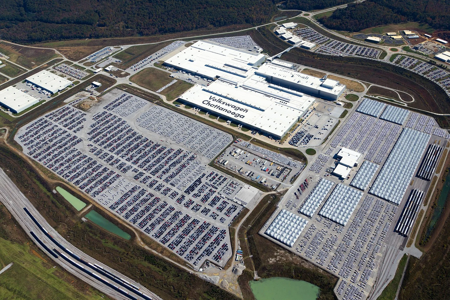 Aerial view of Volkswagen Chattanooga automotive factory, with expansive product staging and multiple facilities.