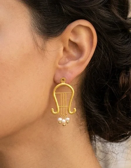 Place_earrings_on_model_202605222003.jpg