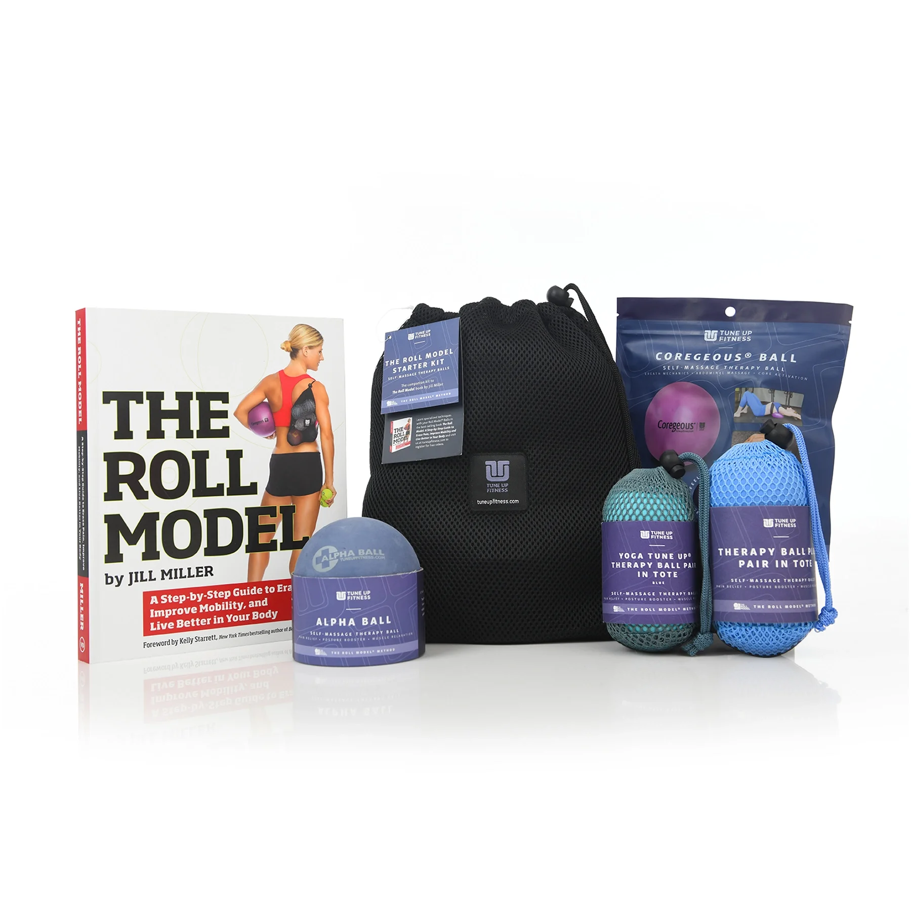 A fitness kit including a book titled 'The Roll Model', a black mesh bag, a purple Coregeous Ball in a bag, a blue Therapy Ball in a tote, a green Yoga Tune Up Ball in a mesh bag, and a blue Alpha Ball for self-massage therapy
