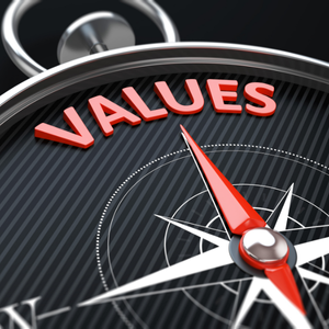Close-up of a compass with the word 'VALUES' in red letters at the top and the needle pointing toward them.