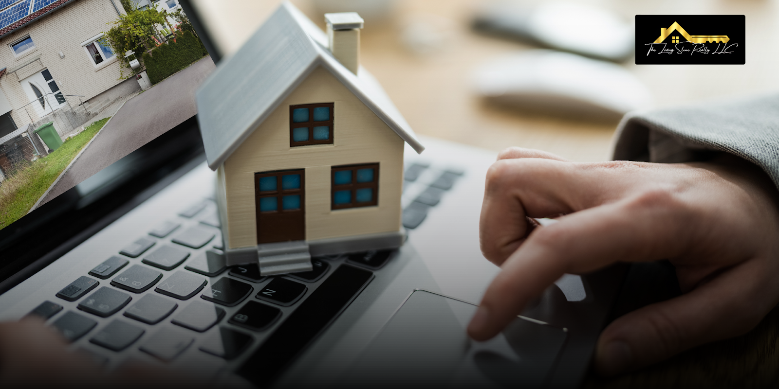 A person using a laptop with a miniature house on the keyboard, showing how to sell my house fast in Reno by taking the first steps in a simple and efficient home-selling process.