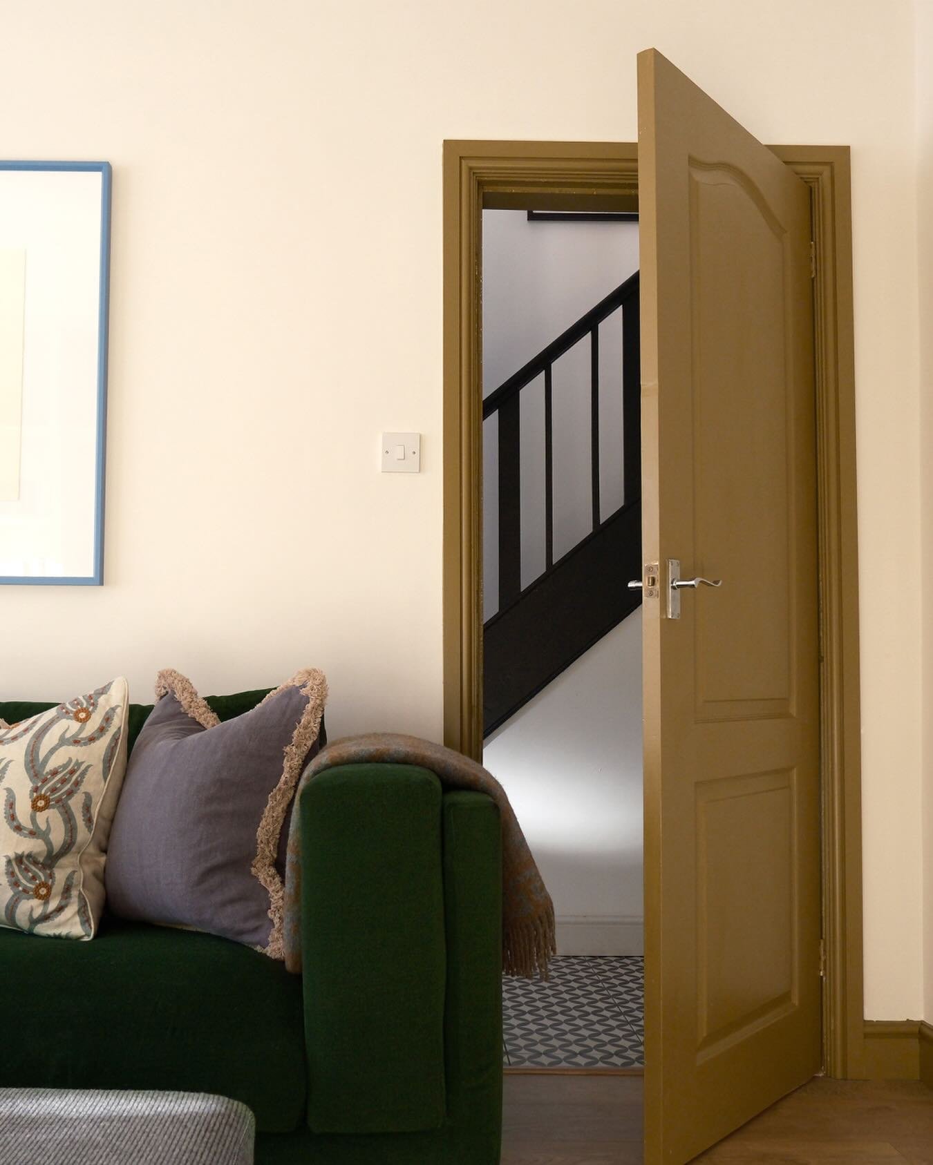 The brief for this room was to make it feel stylish, calm and cosy but also natural and lived-in.

The velvet-like upholstery on the sofa brings richness, while the cushions&mdash;especially the fringed one&mdash;add softness and a slightly bohemian 