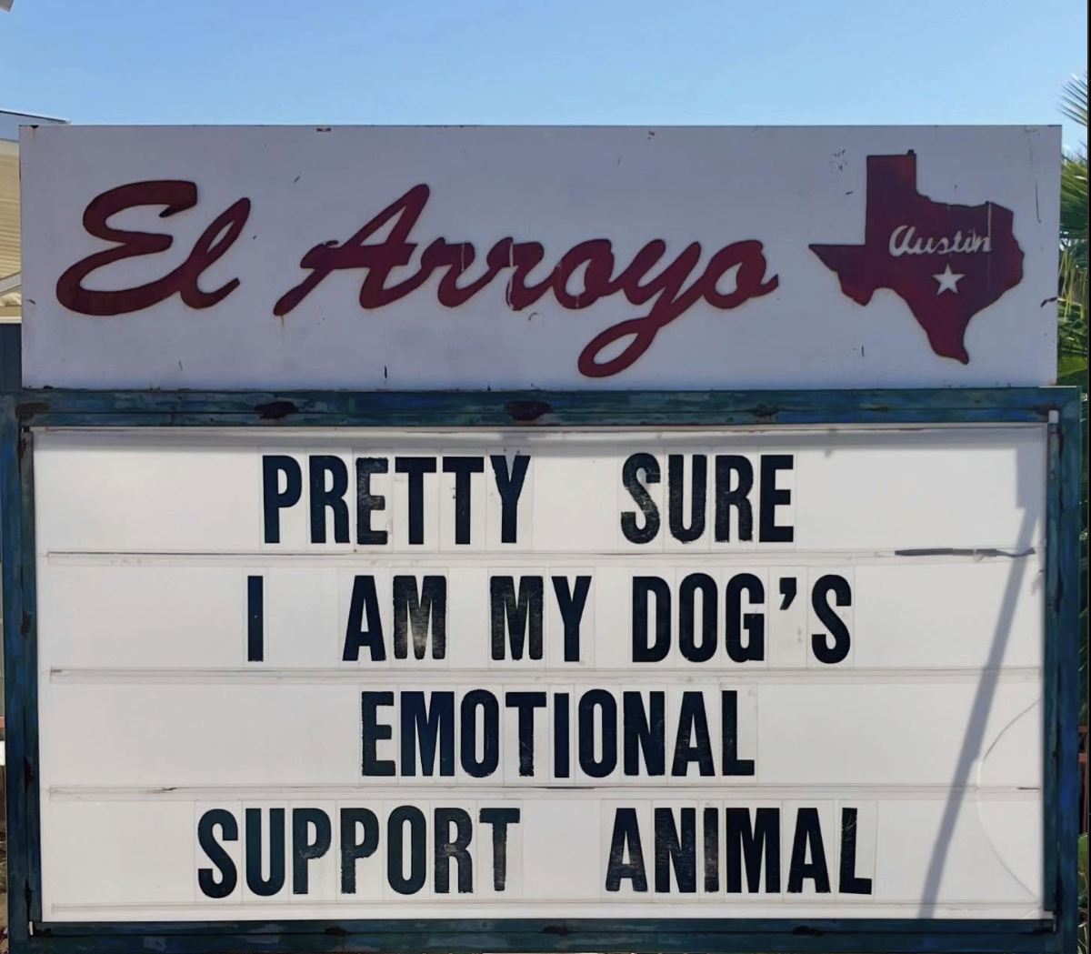 Sign for El Arroyo restaurant in Austin, Texas, with a message: "PRETTY SURE I AM MY DOG'S EMOTIONAL SUPPORT ANIMAL".