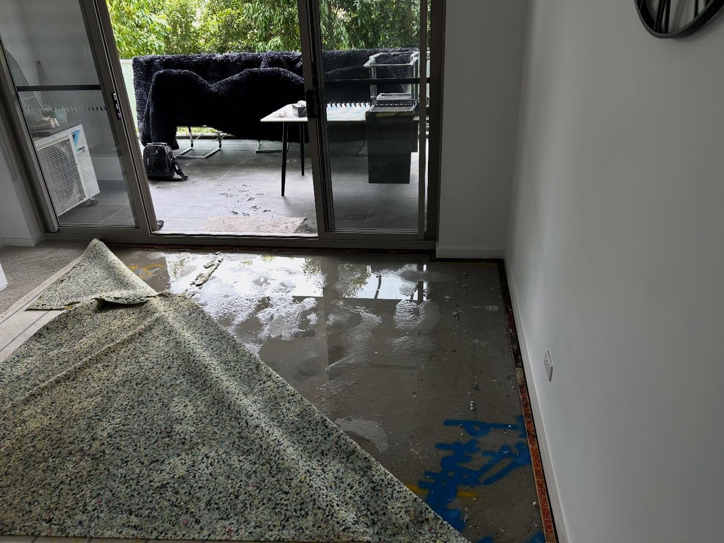 🚨 Leak Detection 🚨 

As shown in the first picture, a substantial amount of water is visible on the unit floor's surface.

Our investigation revealed that the outside walkway waterproofing membrane had failed resulting in this water ingress