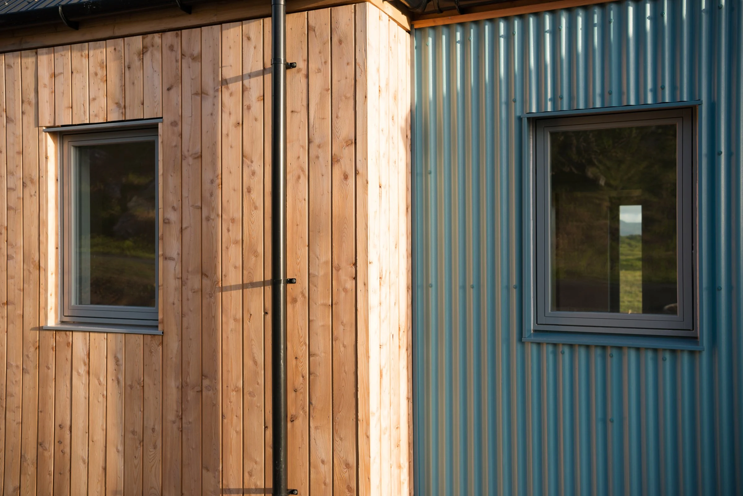 rationel windows, larch cladding, metal cladding, wedgewood blue