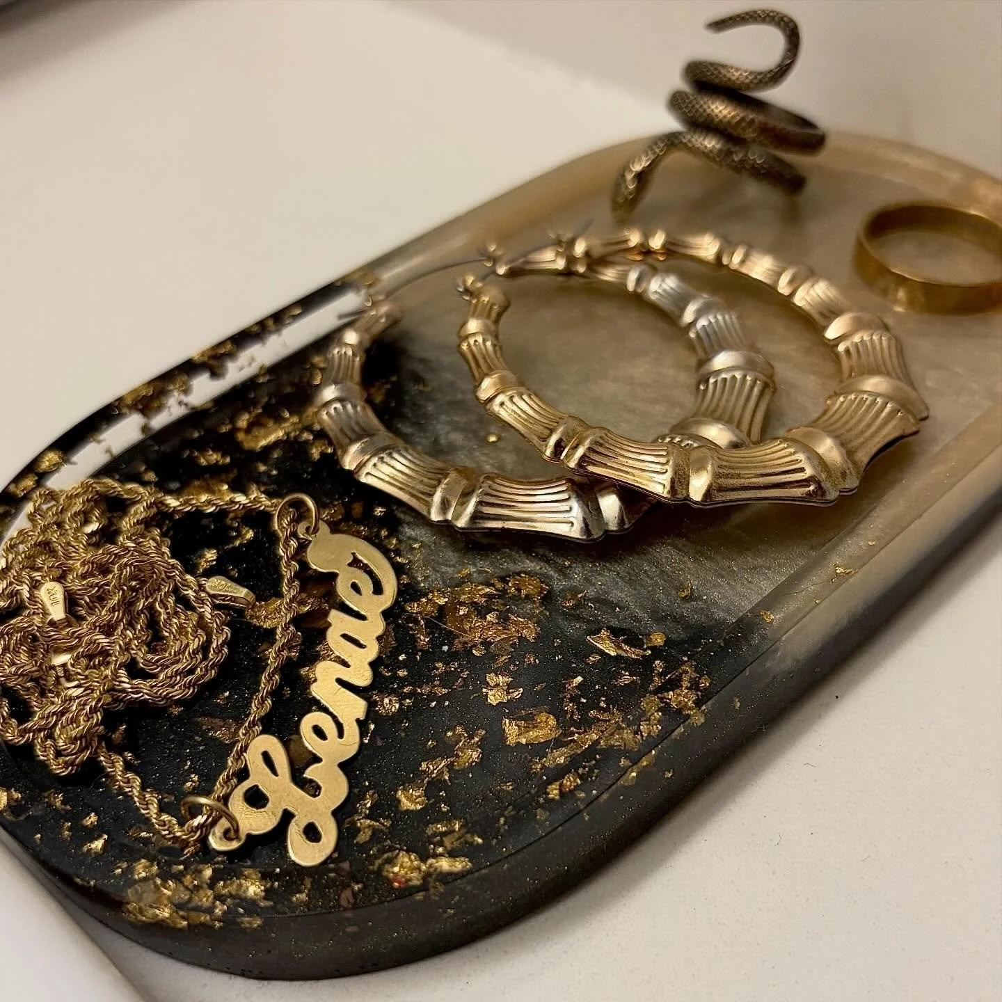 designed to be used, not just displayed ✨ 
my oval trinket trays hold the pieces you reach for every day🖤

custom ordering available via DM or link in bio 📲

#naestrays #trinkettray #handmadehome #resinart #blackownedbusiness