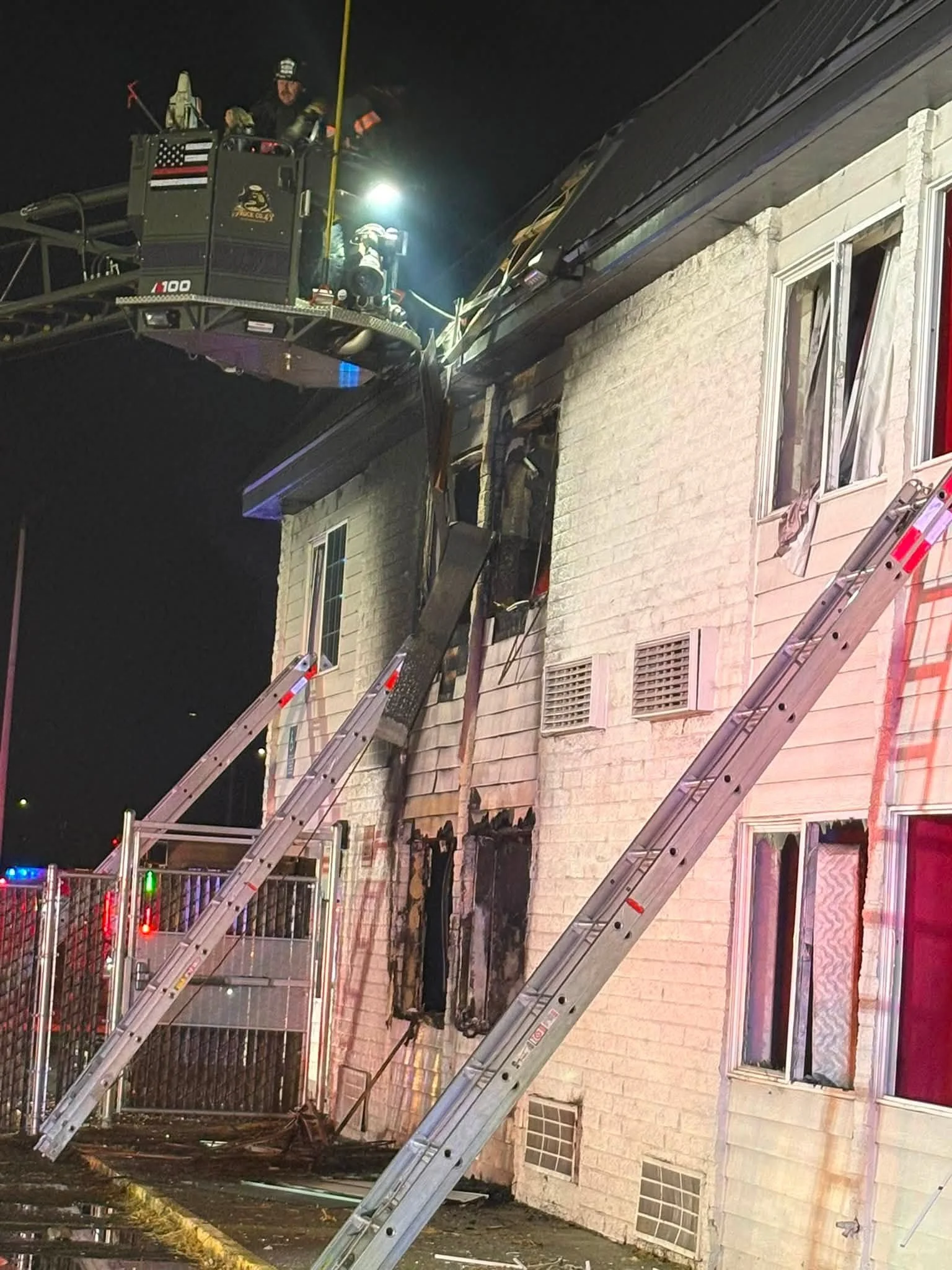   Recent Fire:  Medford firefighters work from an aerial platform following a second-alarm fire at The Loring on Biddle Road Sunday night. The city says the building remains unsafe and uninhabitable.  Medford Fire Department.    