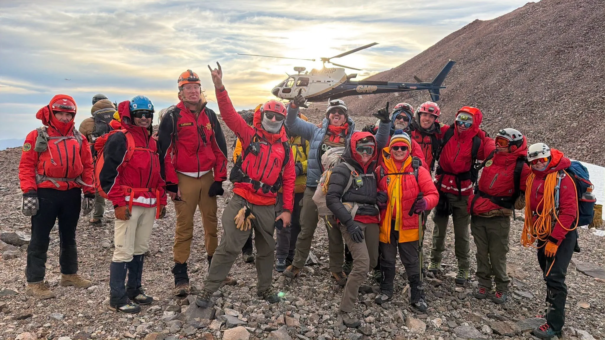   Mount Shasta Rescue Teams:  Members of the multi-agency search and rescue operation gather near a California Highway Patrol helicopter following the successful evacuation of an injured climber. Volunteers and emergency personnel worked through haza