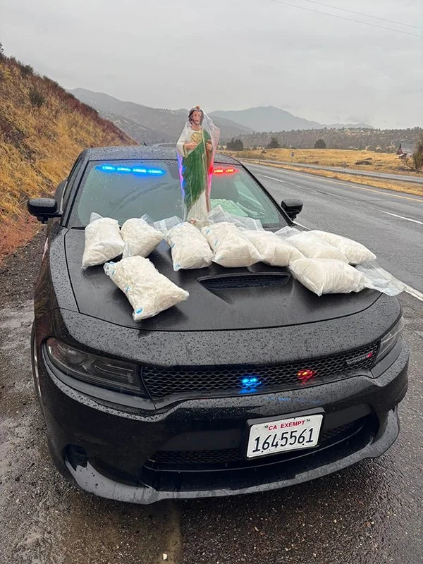   Cover Photo / Nearly 100 Pounds of Methamphetamine Seized:  Packages of methamphetamine are displayed on a Siskiyou County Sheriff's Office patrol vehicle following an October 22, 2026, traffic stop in northern Yreka. Authorities reported seizing 9