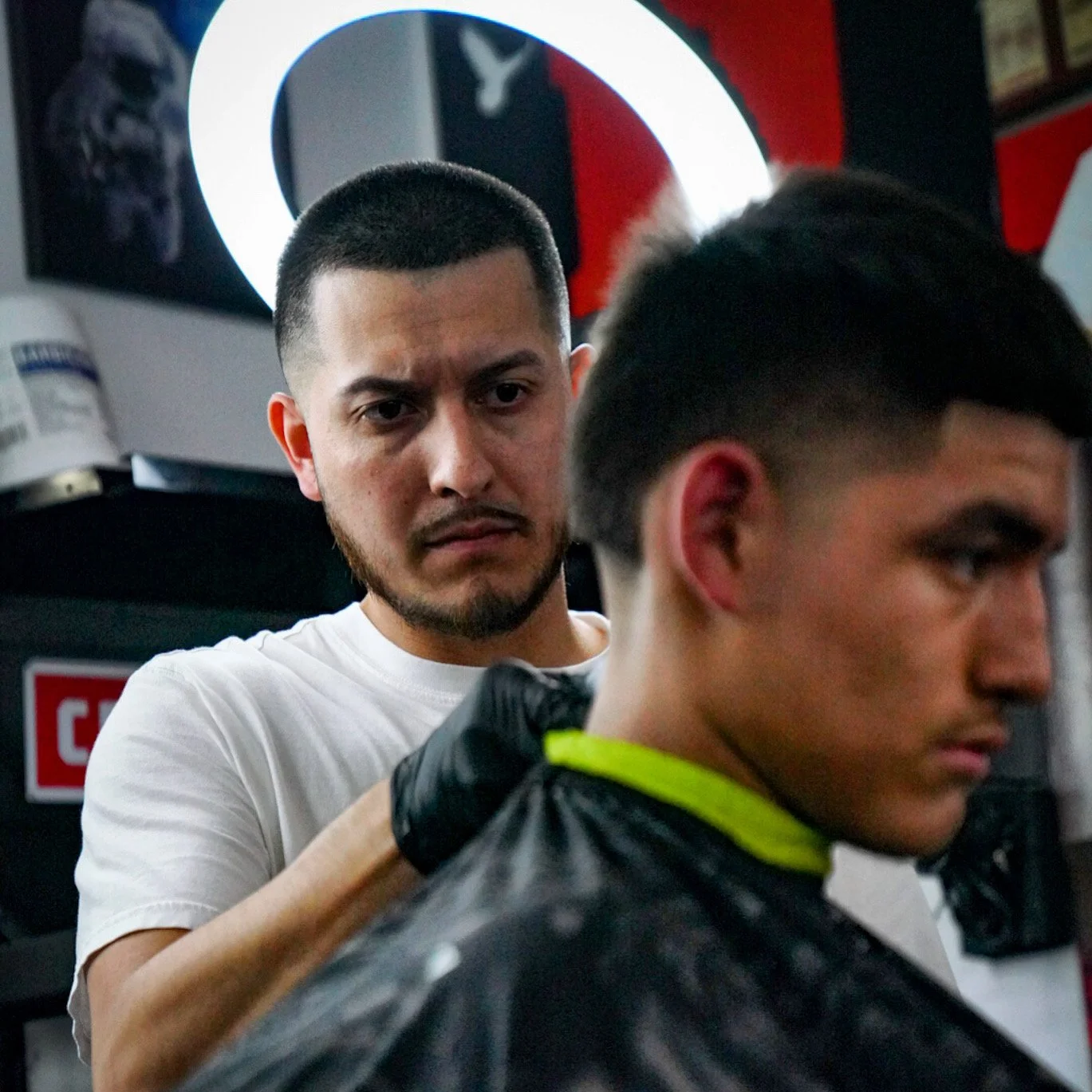 Master barber using RARE grooming techniques during a haircut
