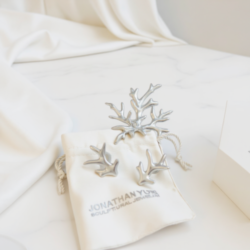 Sterling silver Acropora coral pendant on black velvet ribbon by Jonathan Yun, featured at Miami Modest Fashion Week.