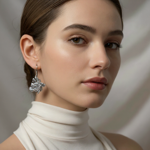 Hand-sculpted sterling silver Acropora coral pendant on black velvet ribbon by Jonathan Yun, featured at Miami Modest Fashion Week.