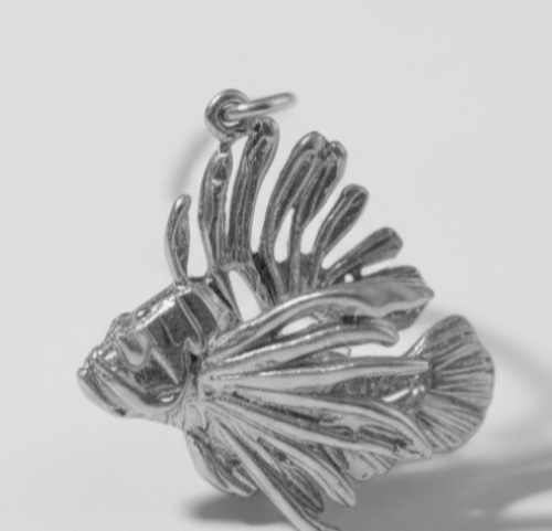 Hand-sculpted sterling silver Acropora coral pendant on black velvet ribbon by Jonathan Yun, featured at Miami Modest Fashion Week.