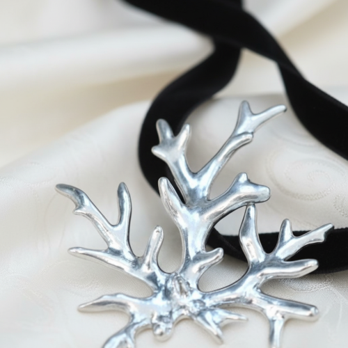 Sterling silver Acropora coral pendant on black velvet ribbon by Jonathan Yun, featured at Miami Modest Fashion Week.