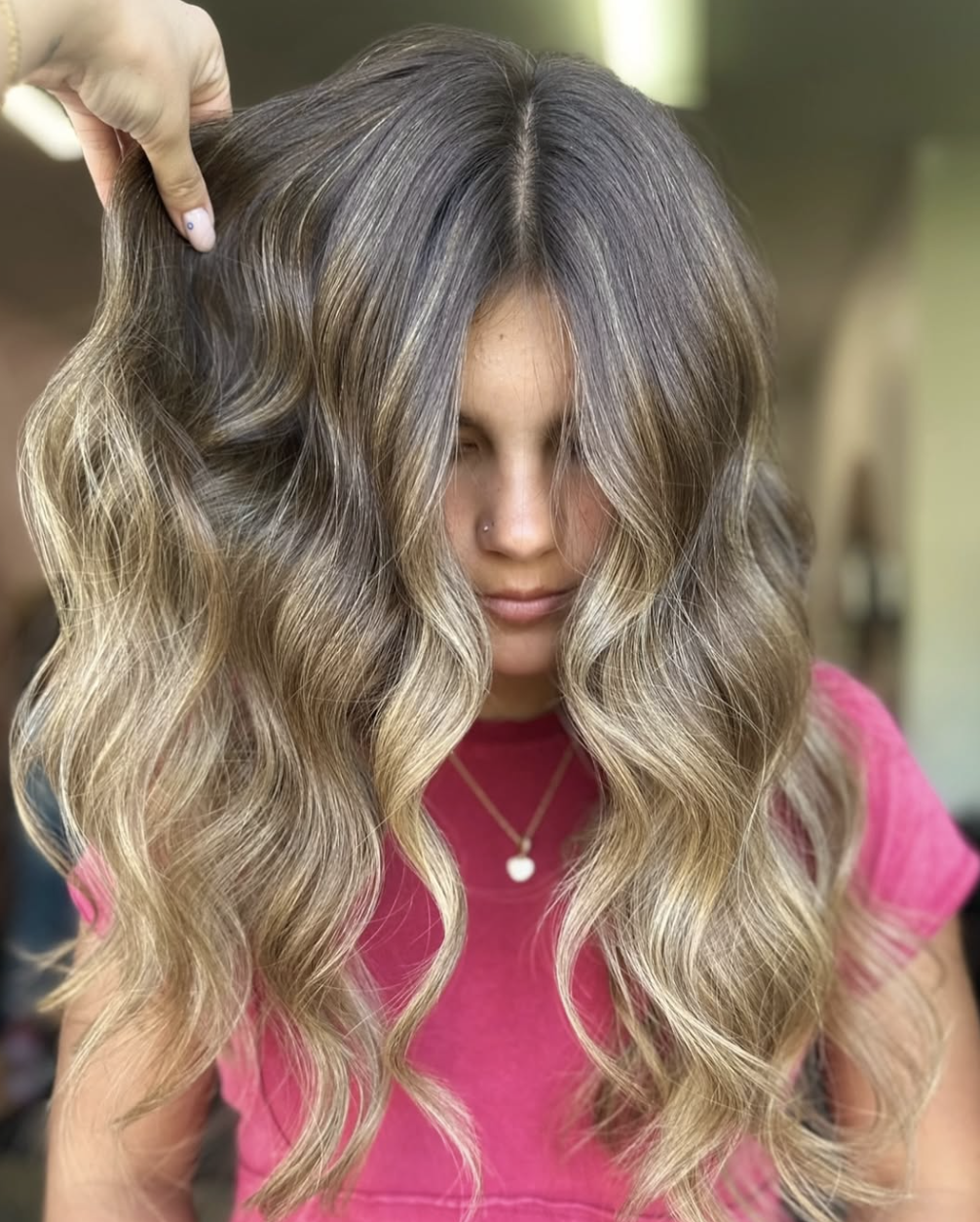 Woman with long hair and blonde highlights