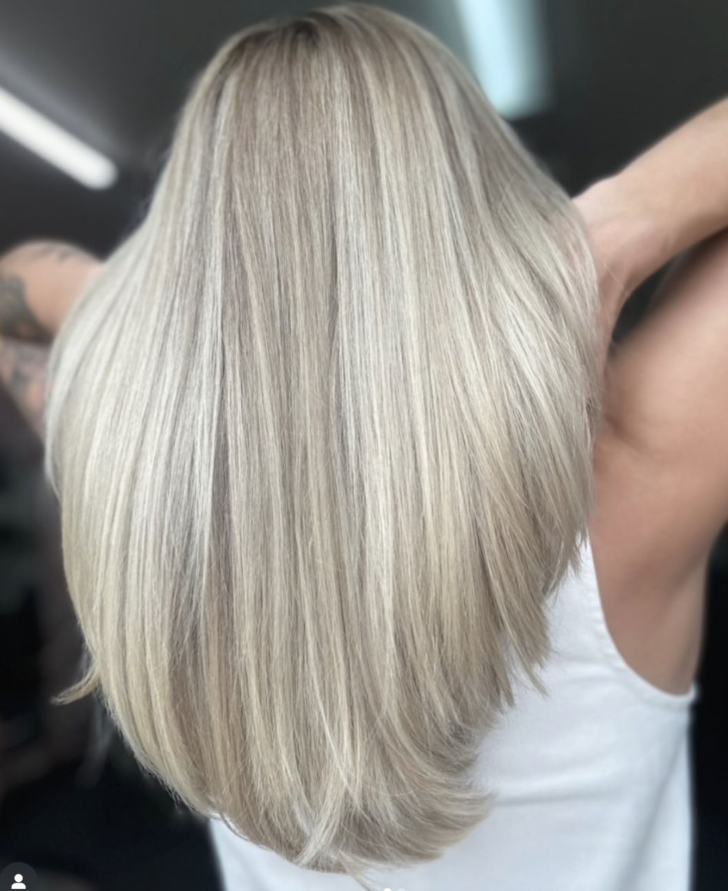 Woman with long blonde straight hair