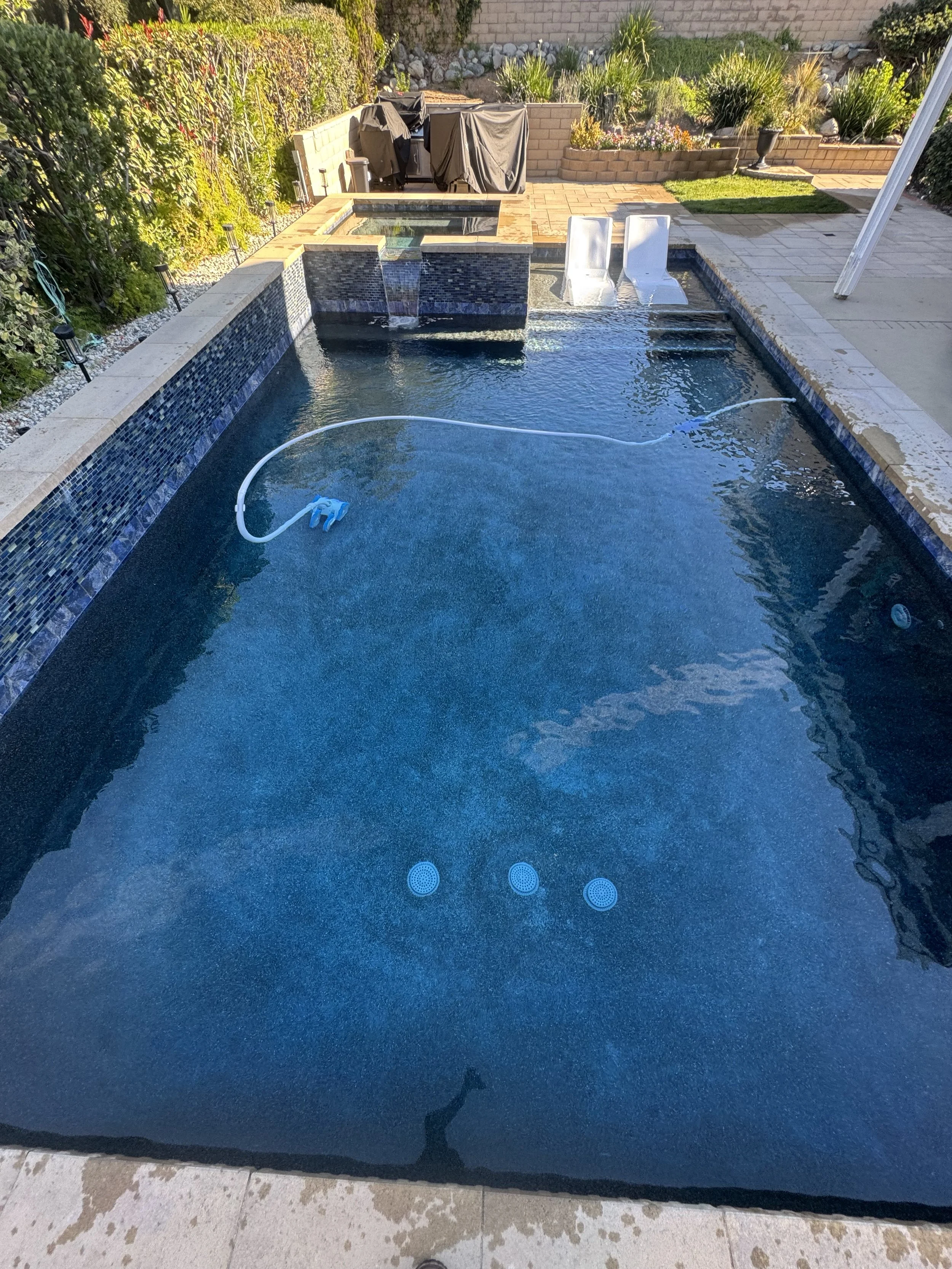 blue pool and sweeper 