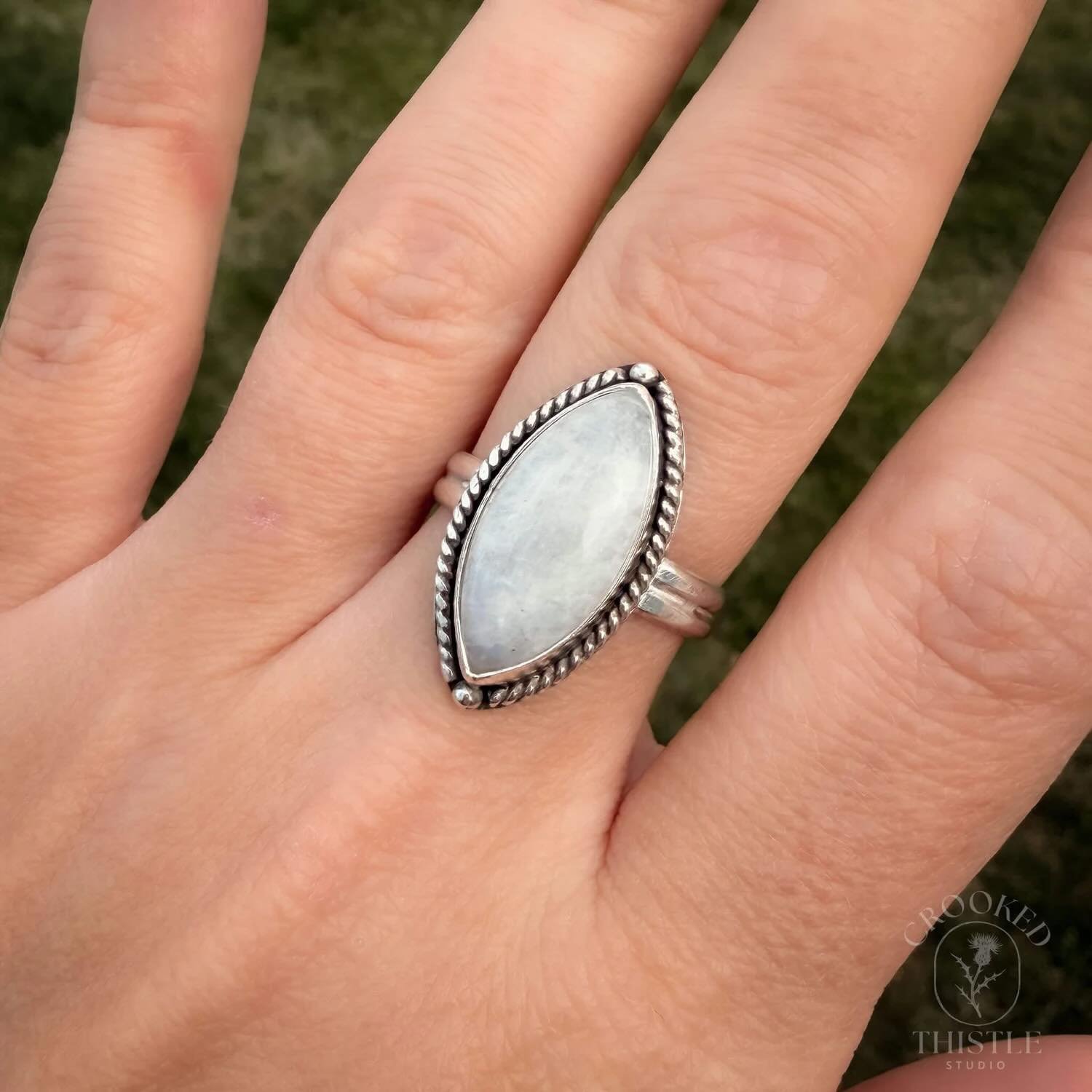 Marquise Moonstone Ring 
Moonstone set in sterling silver with a rope border and subtle end accents. Shop the link in my bio or message me to purchase. 
#moonstonering #sterlingsilverjewelry #handmadejewelry #everydayjewelry #crookedthistlestudio