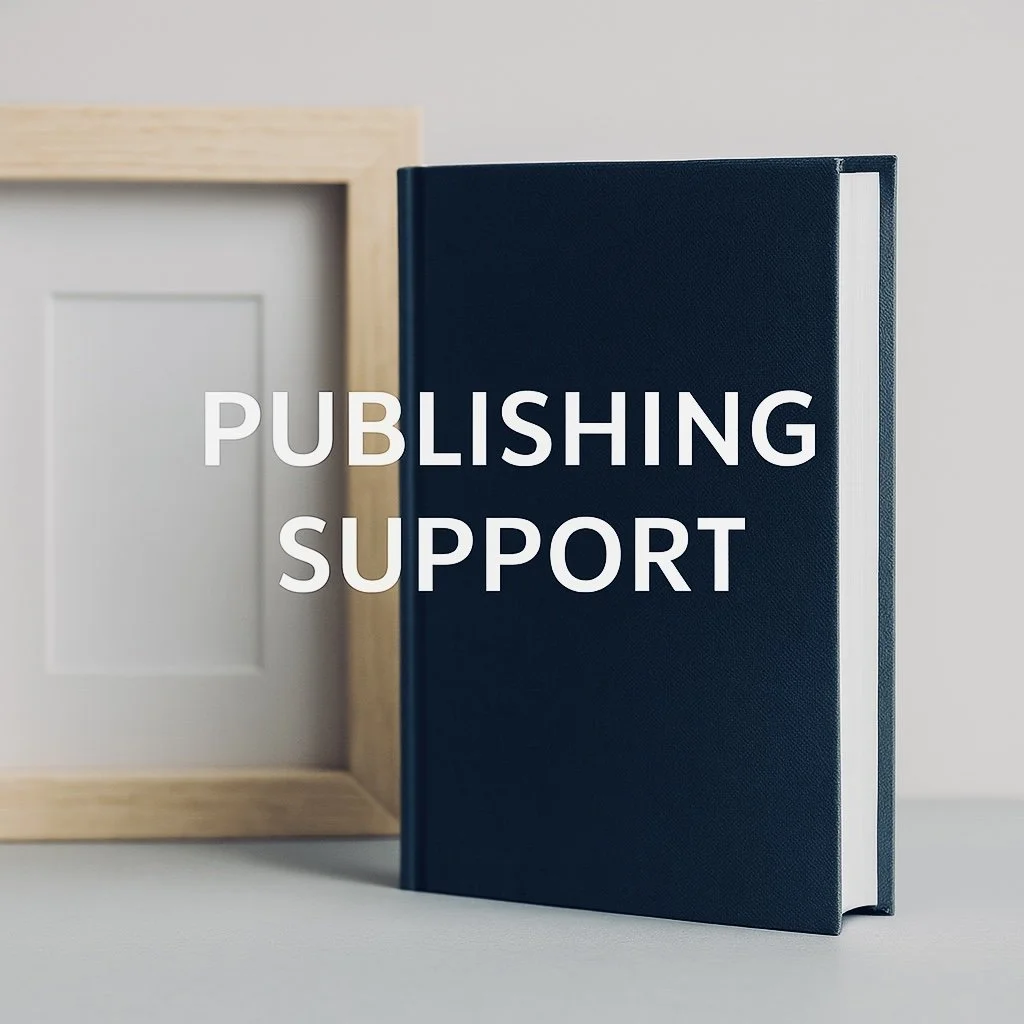 A black hardcover book standing upright next to a blank wooden picture frame on a grey background, with the words 'PUBLISHING SUPPORT' overlaid in white text.