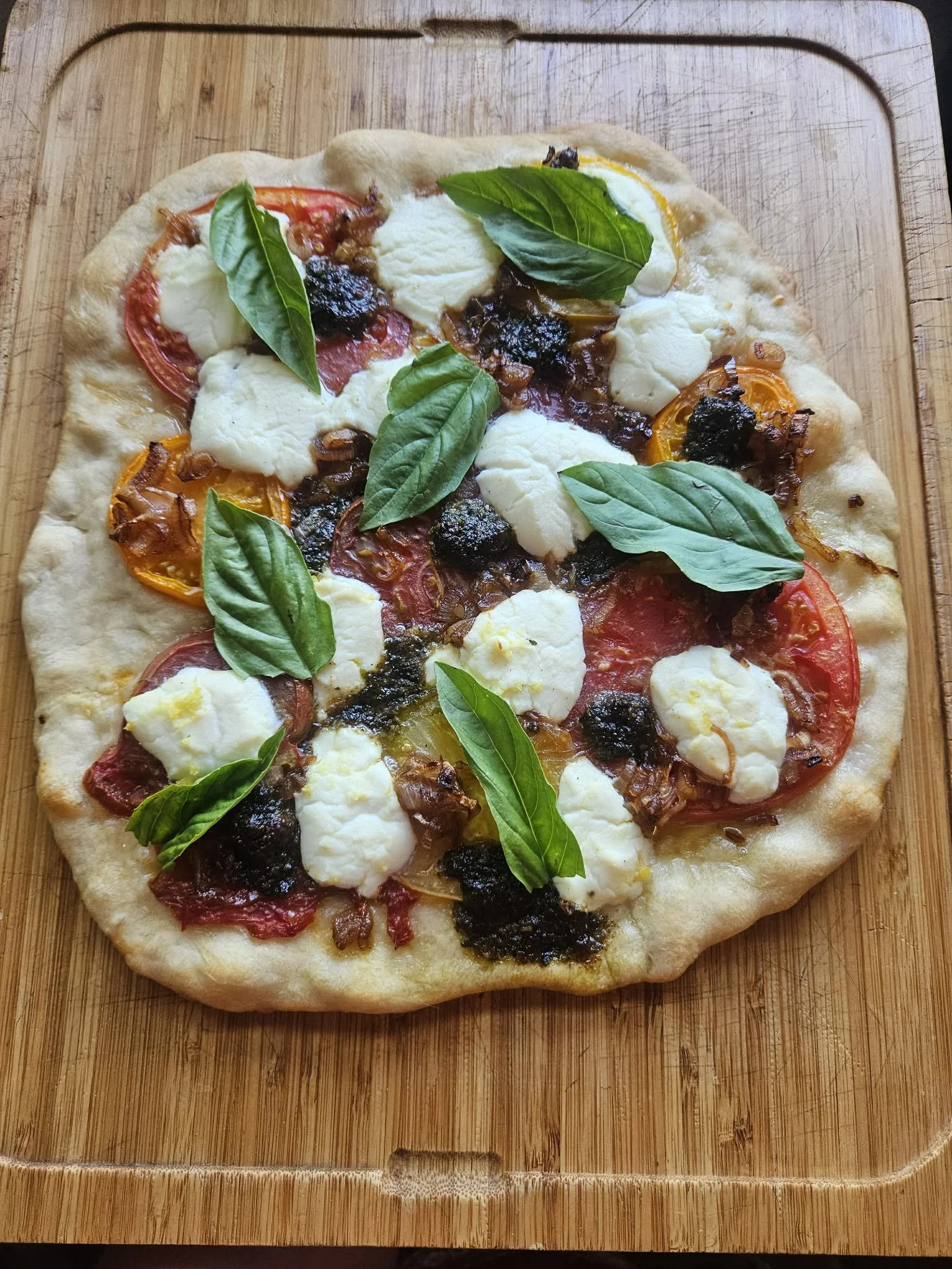 Summer Pizza with Heirloom Tomatoes, Caramelized Onions, Basil Pesto and Lemony Ricotta